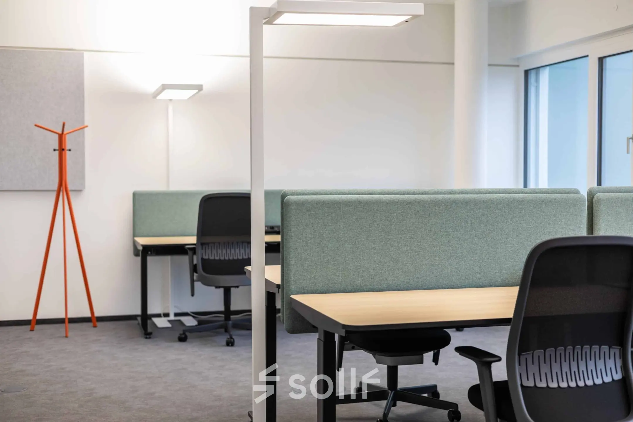 Modern office space ready for rent at Siemensstraße 89, 1210 Vienna. Features ergonomic chairs, desks, and ample lighting in a clean layout.