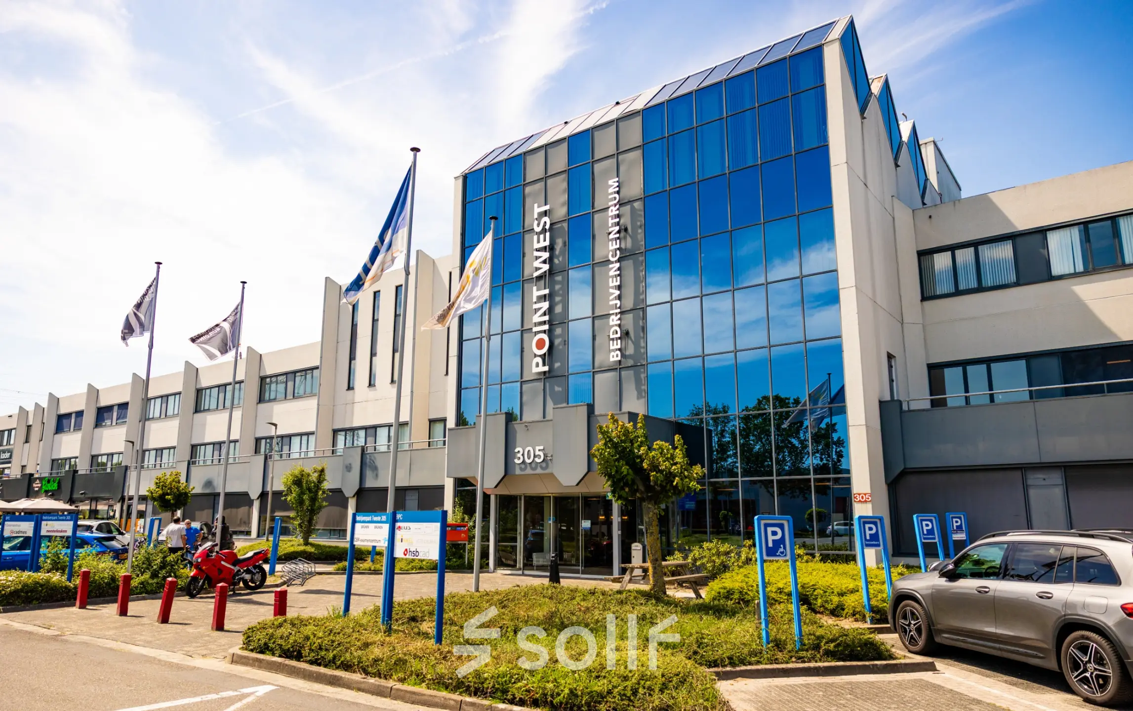 Exterior view of the office building at Bedrijvenpark Twente 305, Almelo, showcasing available office space rental options.