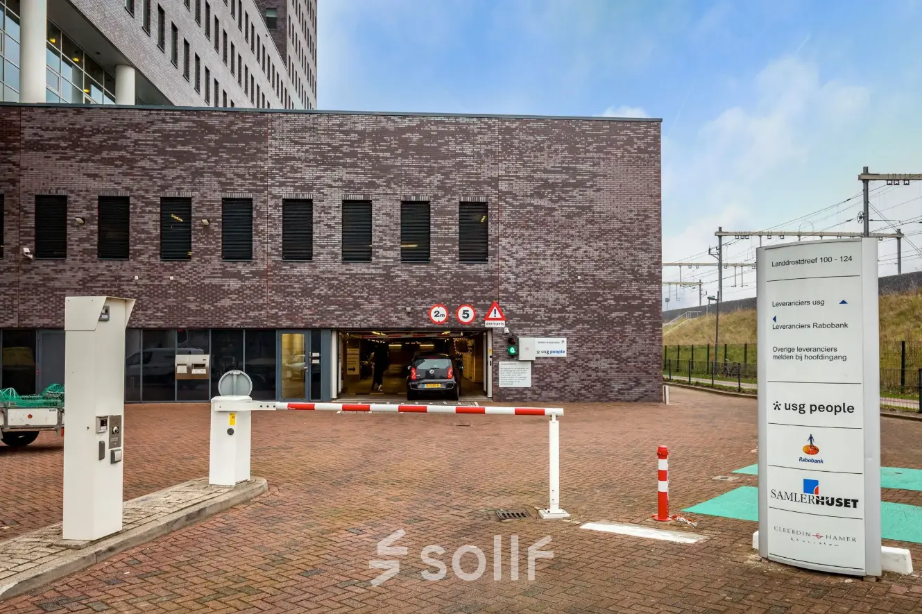 Exterior view of Landdrostdreef 124, Almere Stad, showing office space rental entrance with parking access.