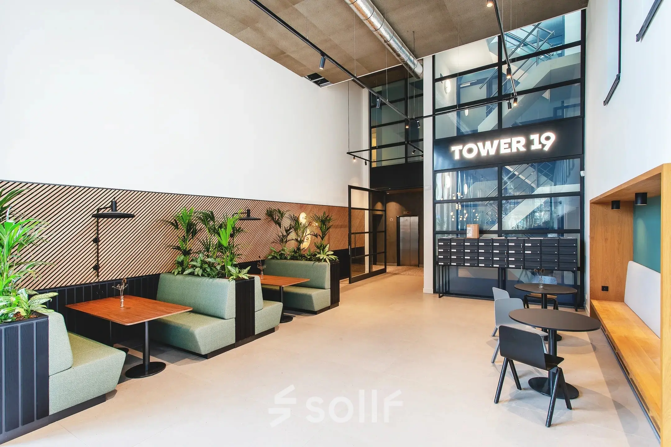 Modern office interior at Landdrostdreef 124, Almere Stad, featuring stylish seating and tables ideal for a flexible workspace rental.