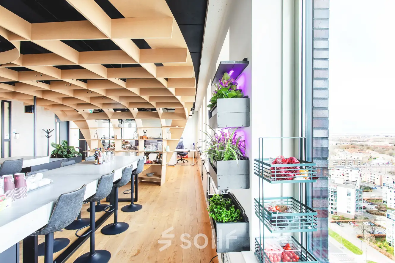 Bright office space at Landdrostdreef 124, Almere Stad with modern furnishings, large windows, and a view. Ideal for those looking to rent office space with natural light and greenery.