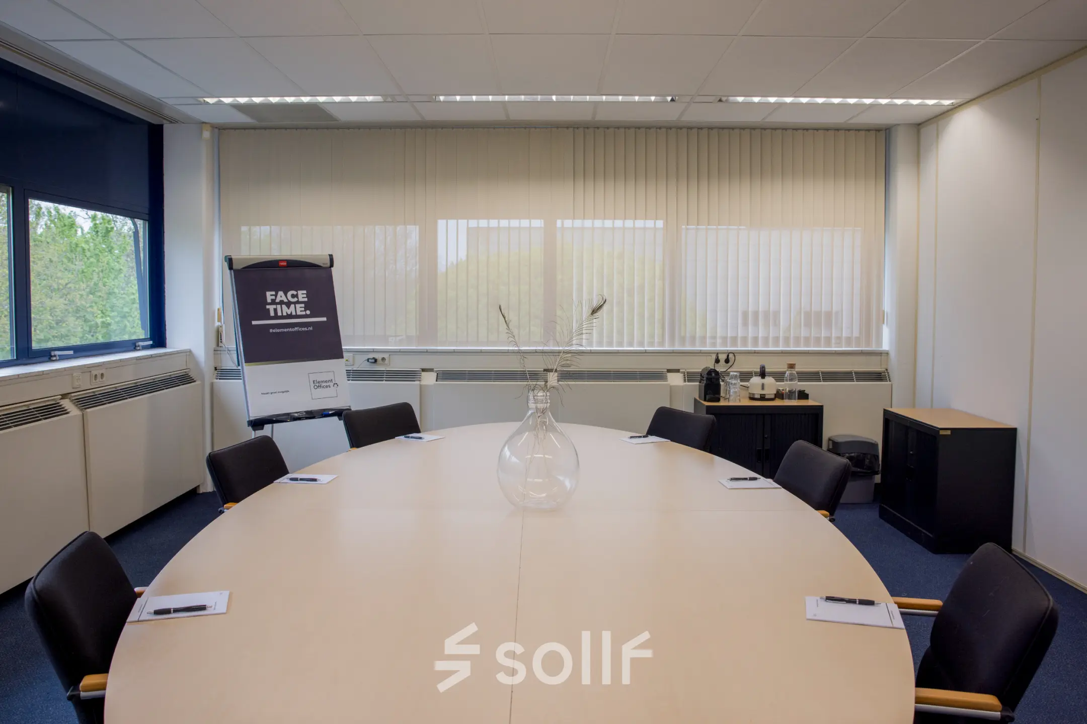 Office space at Markerkant 1310, Almere Stad with a large round table, chairs, and presentation board, available for rent.
