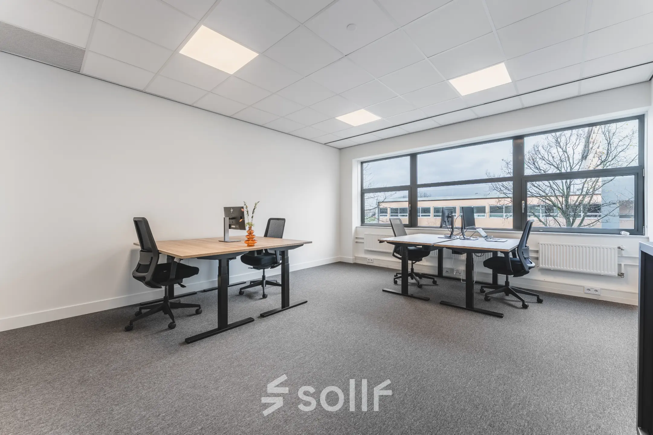 Bright and airy office space at Veluwezoom 15, Almere Stad, featuring modern desks and chairs, perfect for office space rental.