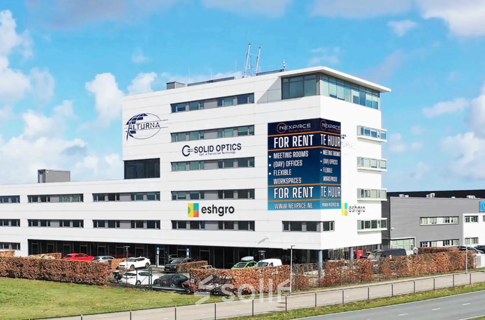 Exterior view of Veluwezoom 15 in Almere Stad featuring available office spaces for rent in a modern building.