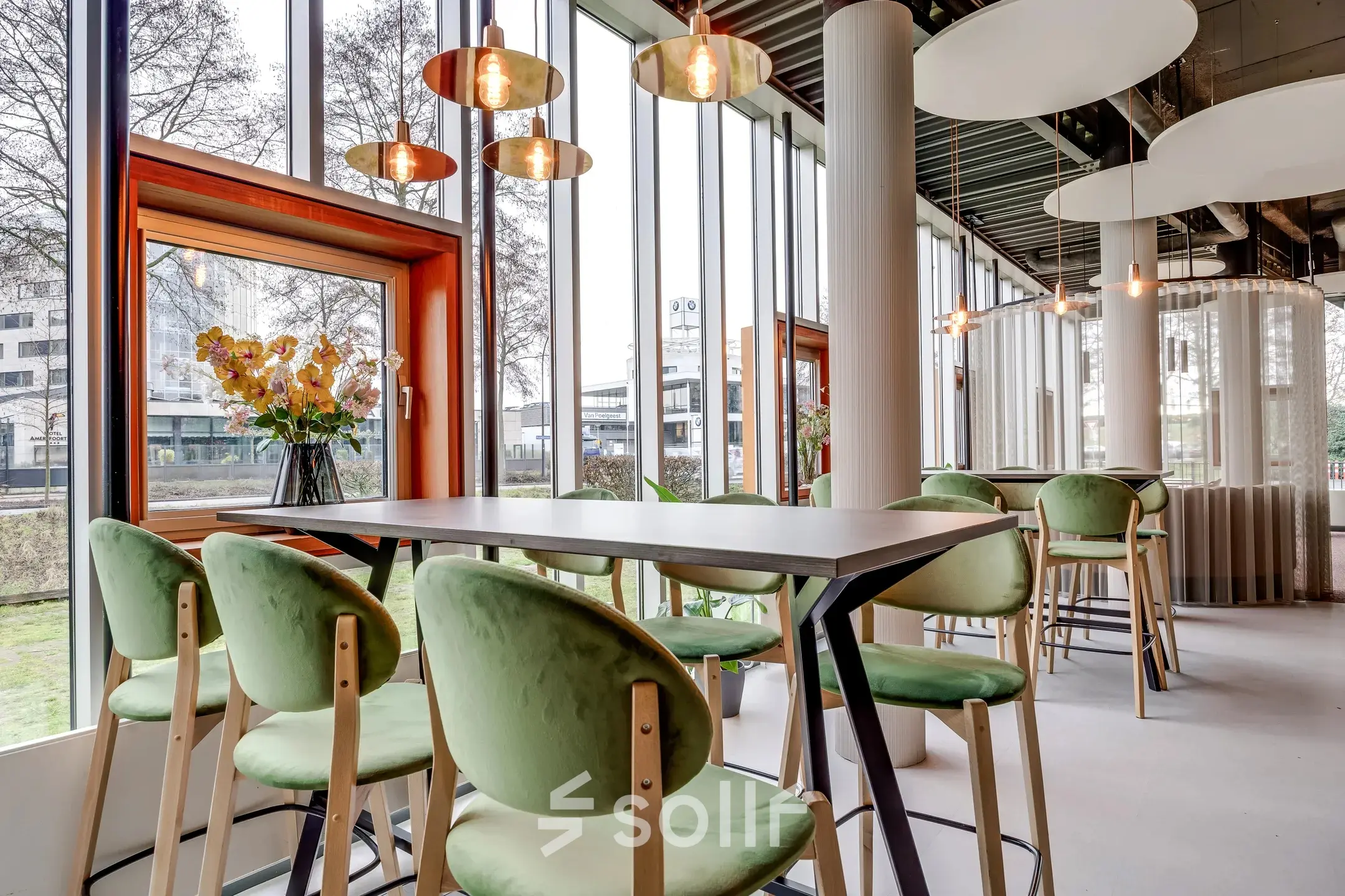 Bright Amersfoort Calveen office interior at Maanlander 47, featuring a stylish, furnished open floorplan with large windows and modern lighting, ideal for office space rental.