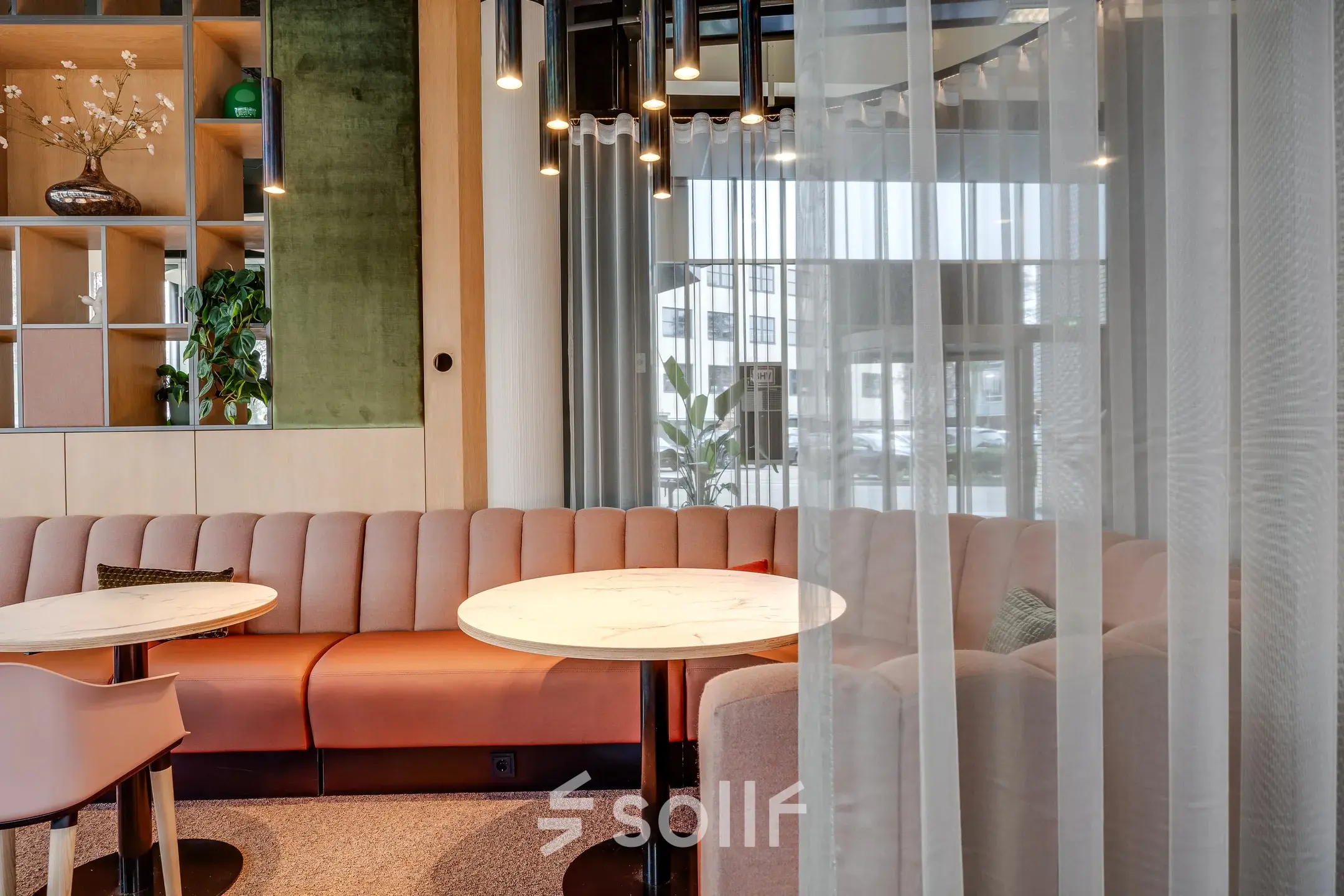 Stylish office lounge area at Maanlander 47, Amersfoort Calveen, perfect for office space rental with a cozy seating arrangement and modern decor.