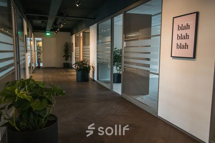 Interior hallway at Ruimtevaart 24, Amersfoort Calveen, ideal for office space rental with glass partitioned offices.