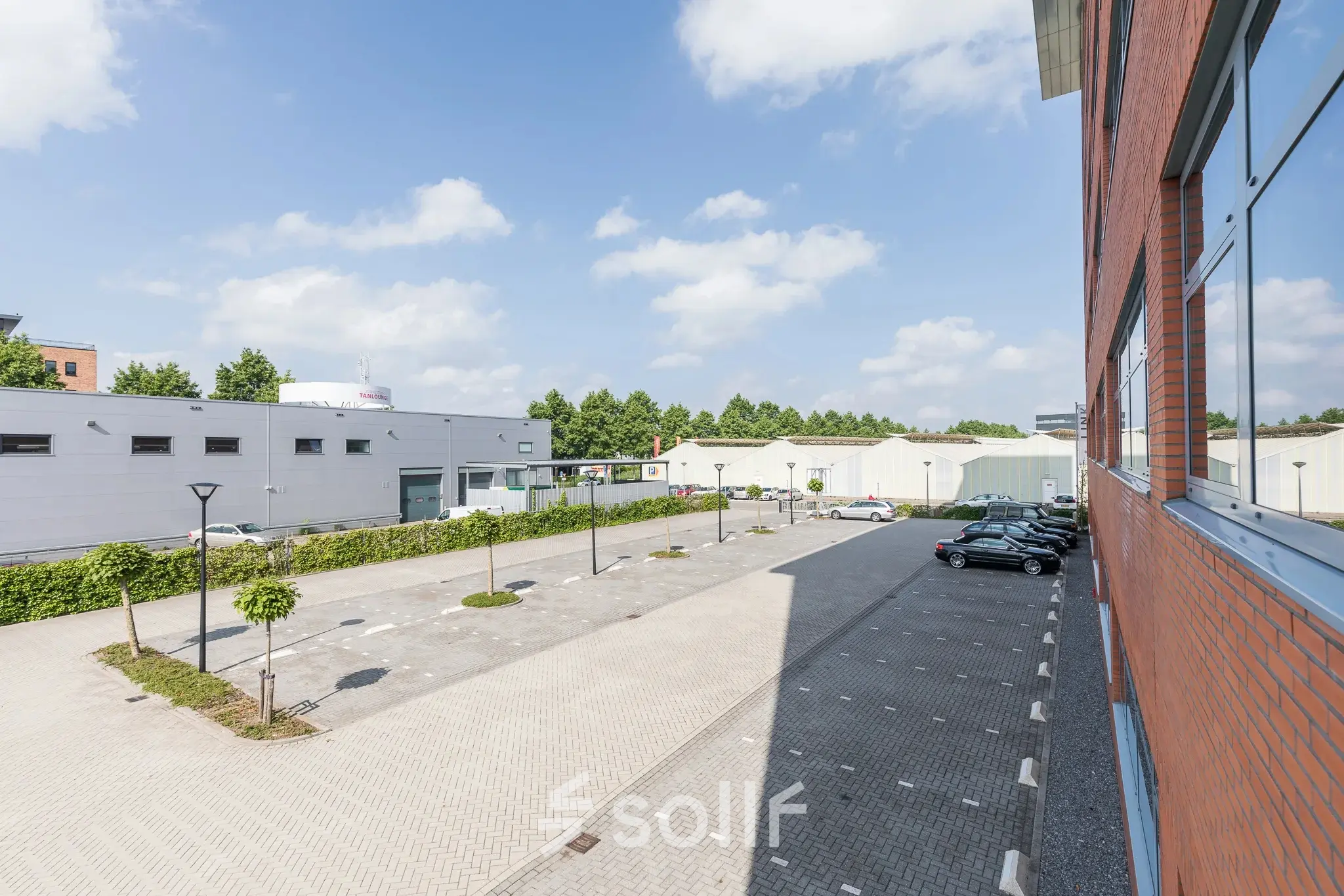Exterior view of office buildings at Spoetnik 10-64, Amersfoort Calveen, showcasing available office space rental with parking facilities.