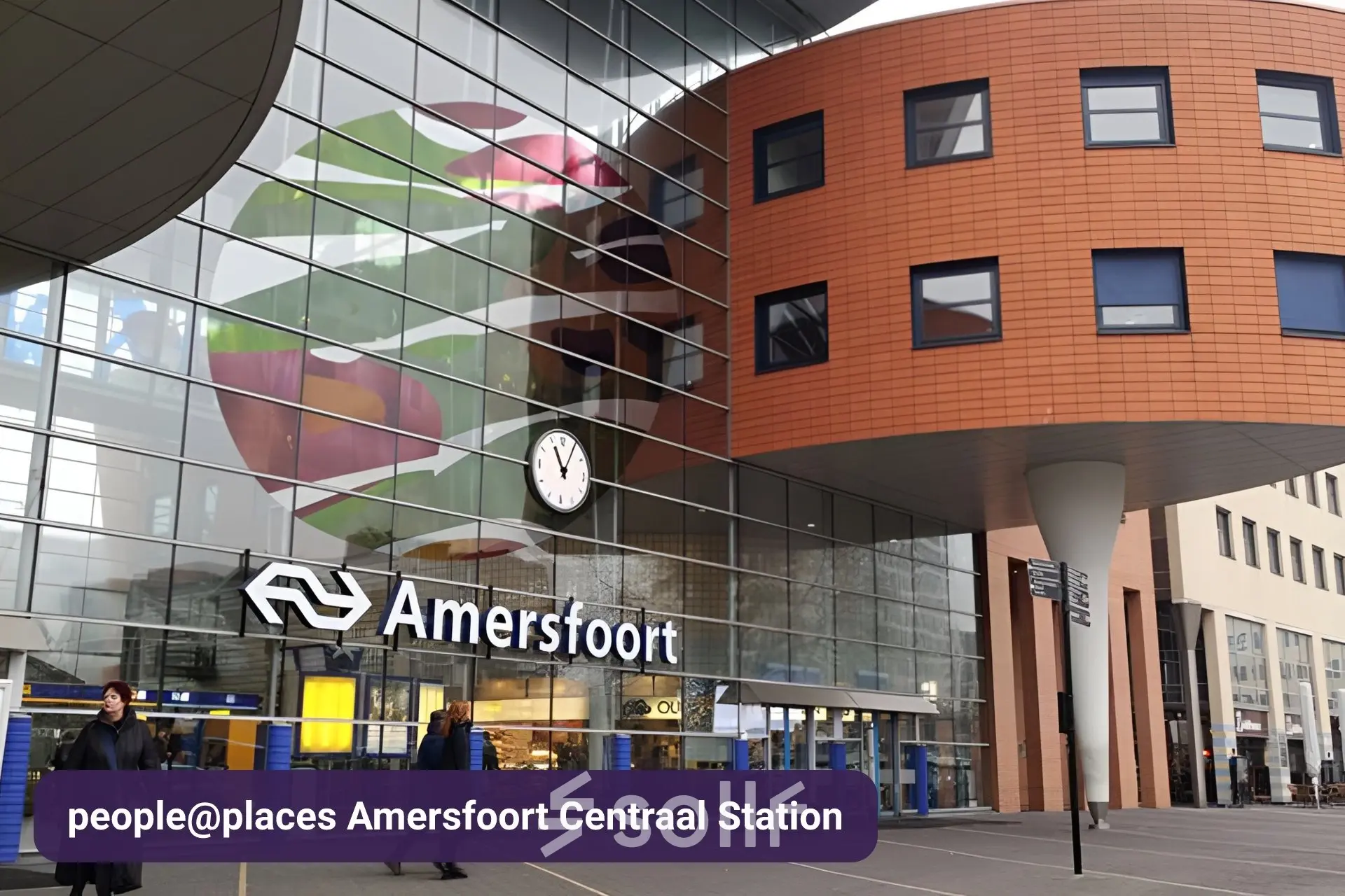 Exterior view of Amersfoort Centraal Station, featuring the entrance with glass walls and signage, suitable for those seeking to rent office space nearby.