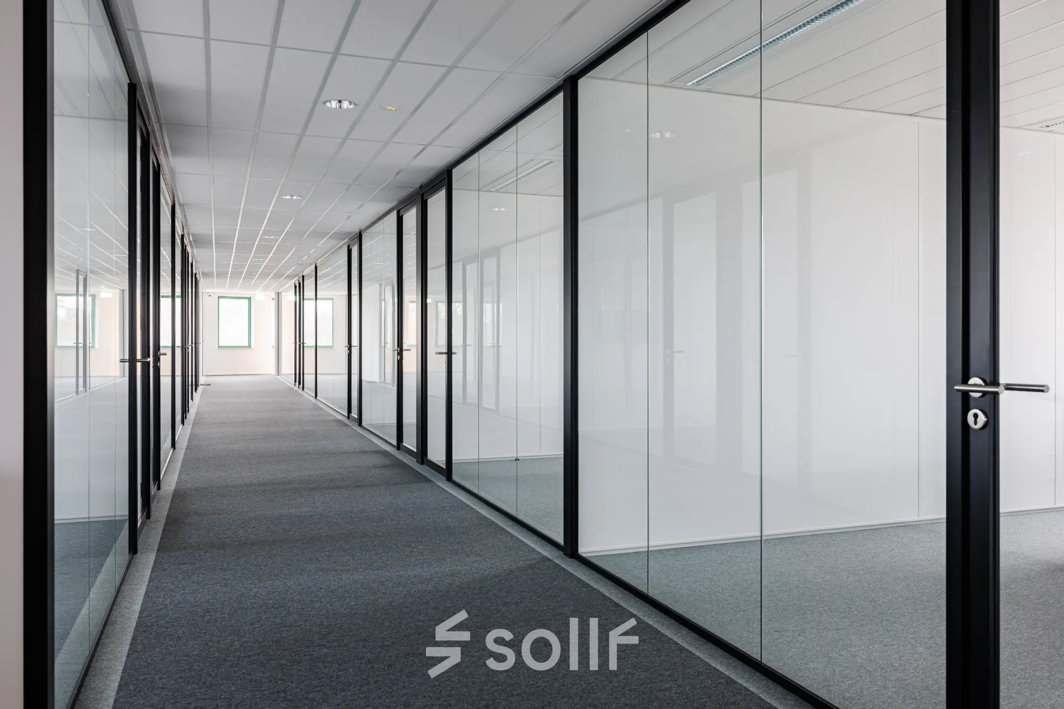 Modern office corridor at Stadsring 201, Amersfoort Centrum, showcasing sleek glass partitions ideal for office space rental opportunities.