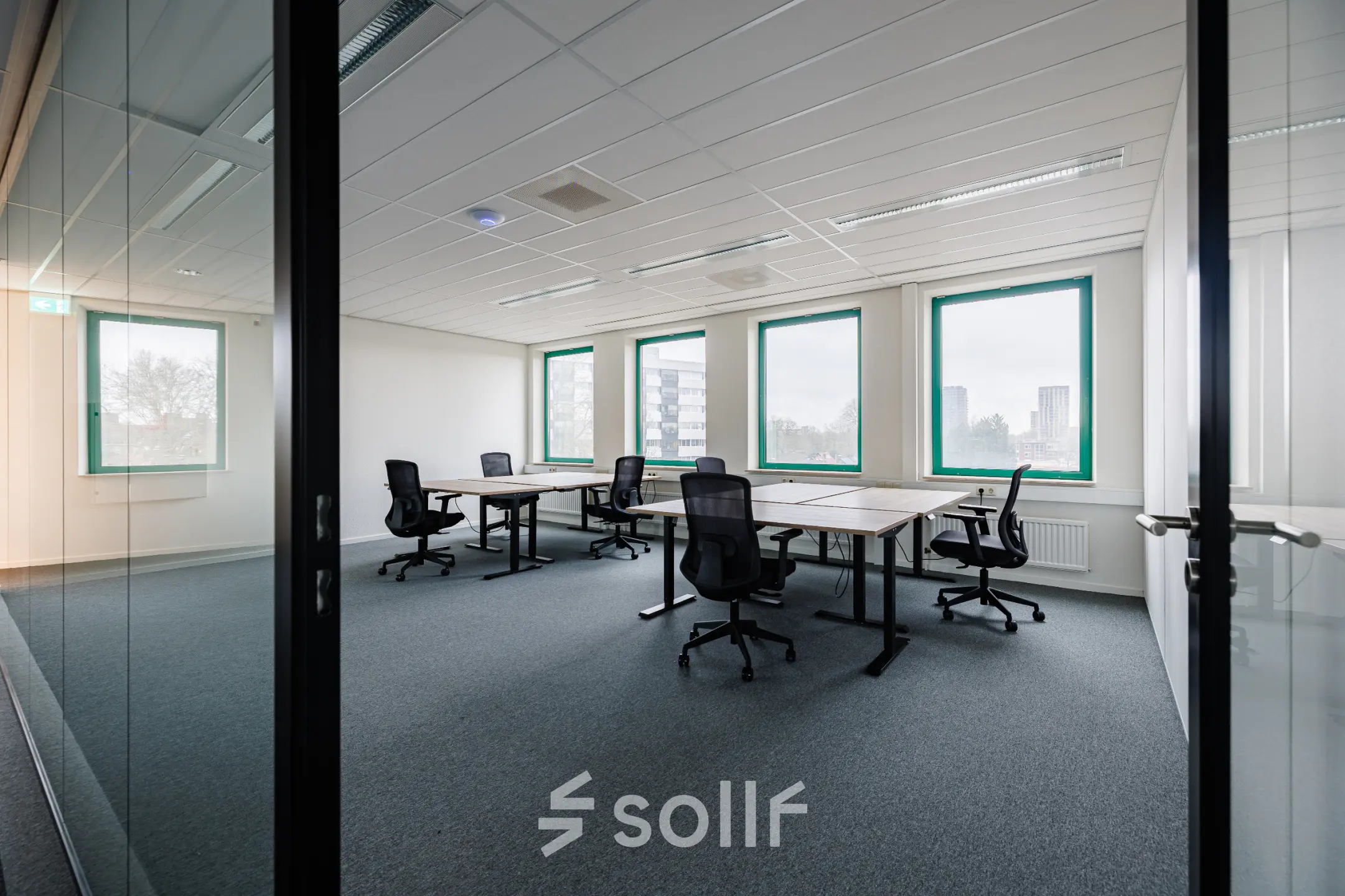 Spacious, bright office to rent at Stadsring 201, Amersfoort Centrum, featuring multiple desks and chairs, suitable for collaborative work activities.