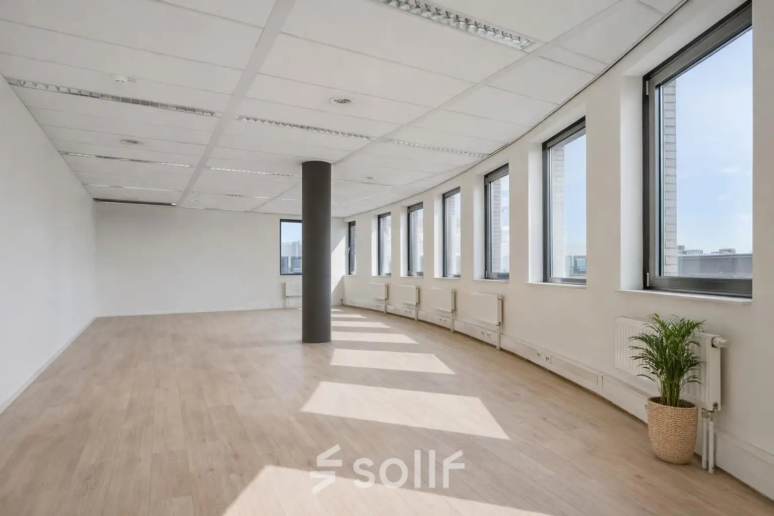 Spacious office to rent at Asch van Wijckstraat 2-4, featuring large windows and natural lighting, ideal for workspace opportunities in Amersfoort Centrum.