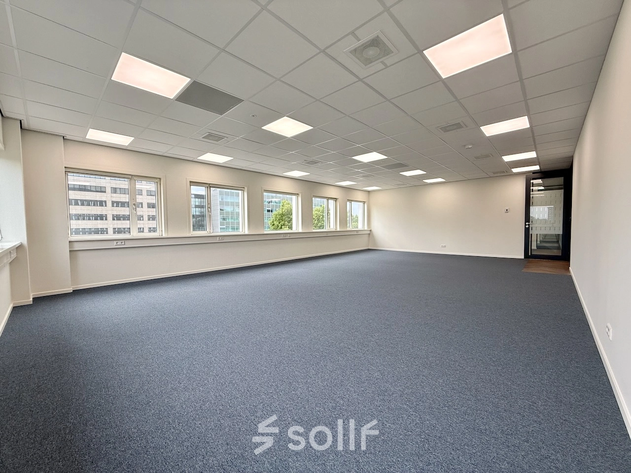 Spacious unfurnished office interior at Professor E.M. Meijerslaan 1, Amstelveen, ideal for rent office space needs, featuring large windows allowing ample light.