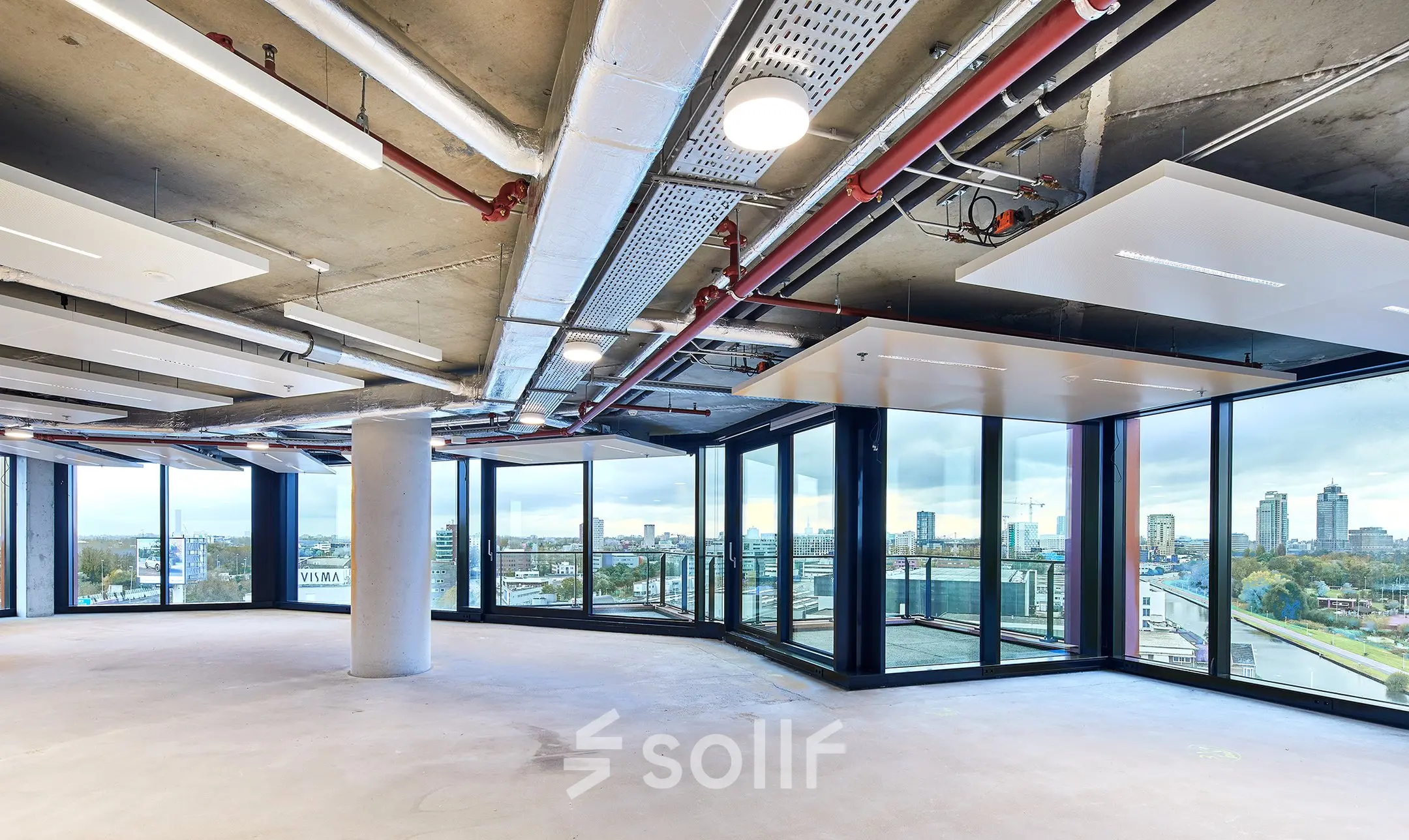 Spacious open floor plan office located at H.J.E. Wenckebachweg 230-258 in Amsterdam Amstel Business Park, featuring large windows with city views. Ideal for office space rental.