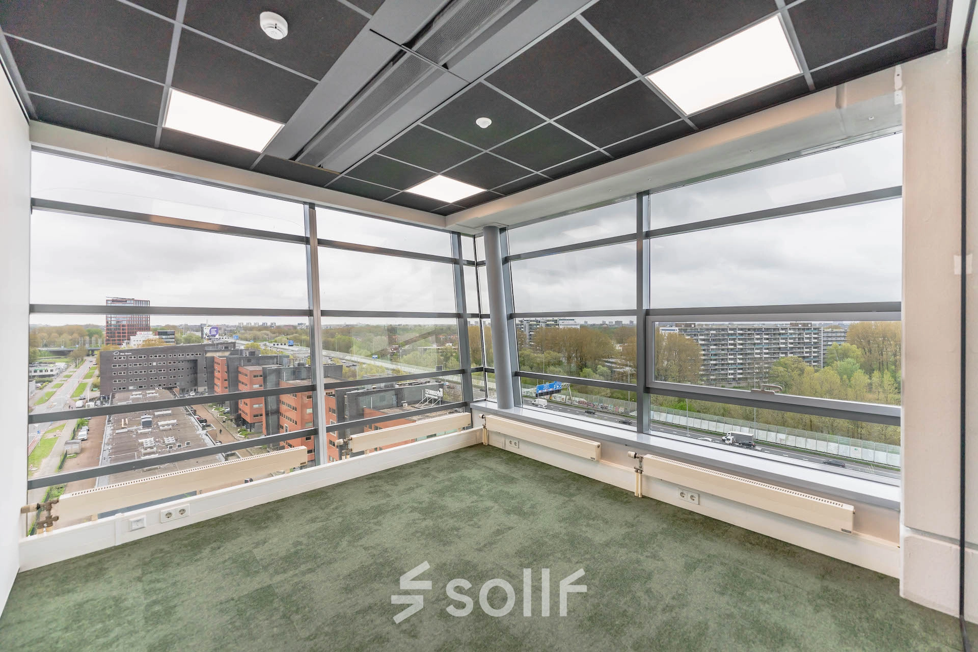 Spacious, unfurnished office space available for rent in Amsterdam Amstel Business Park, with large windows offering a panoramic view. Ideal for an office space rental.