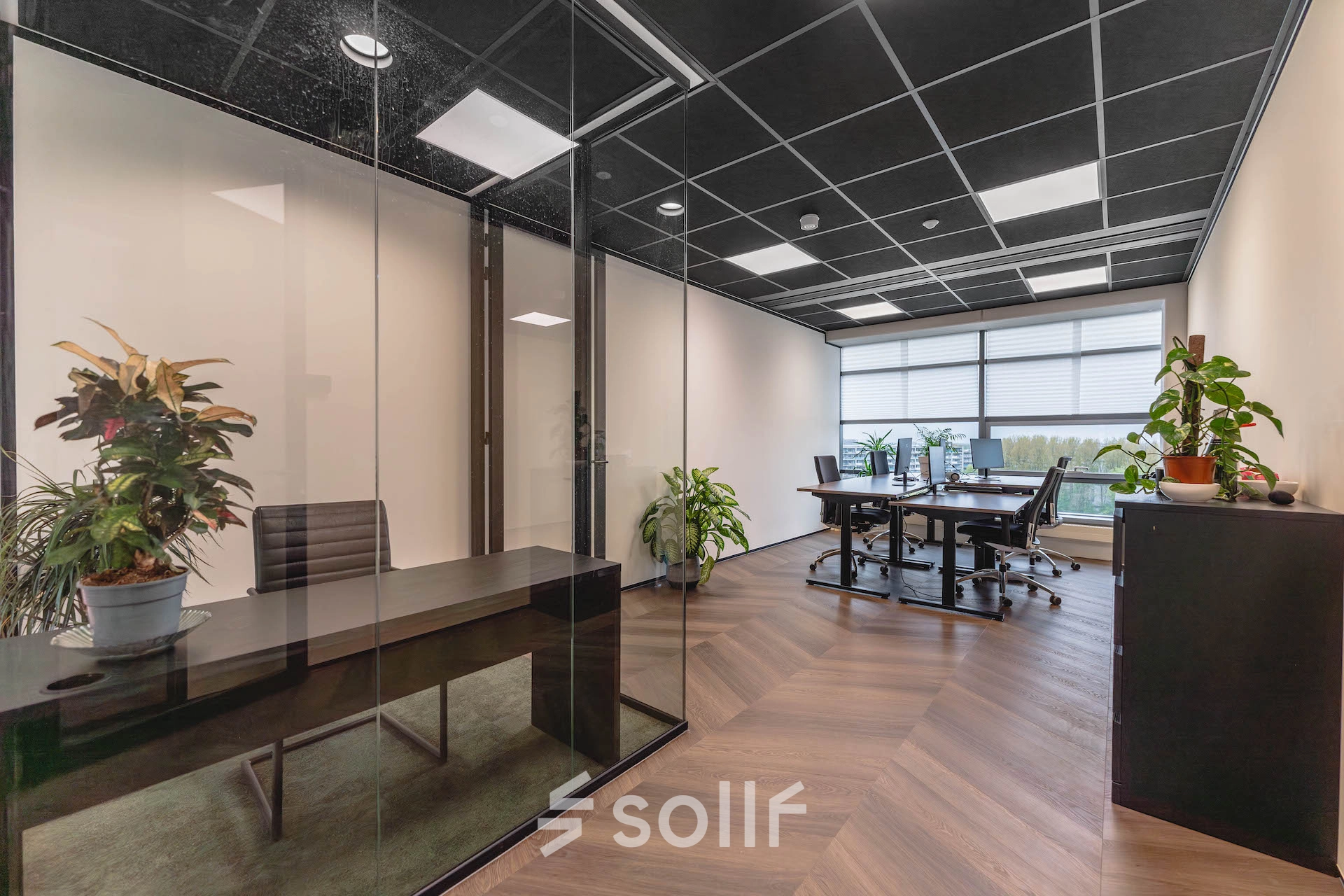 Modern office space with glass partitions and stylish furnishings at Joop Geesinkweg 201, Amsterdam Amstel Business Park, available for office space rental.