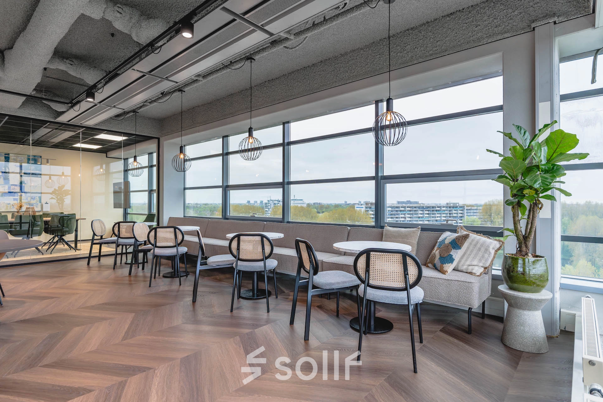 Chic office space featuring stylish seating and large windows at Joop Geesinkweg 201 in Amsterdam Amstel Business Park. Ideal for companies seeking office space rental opportunities.