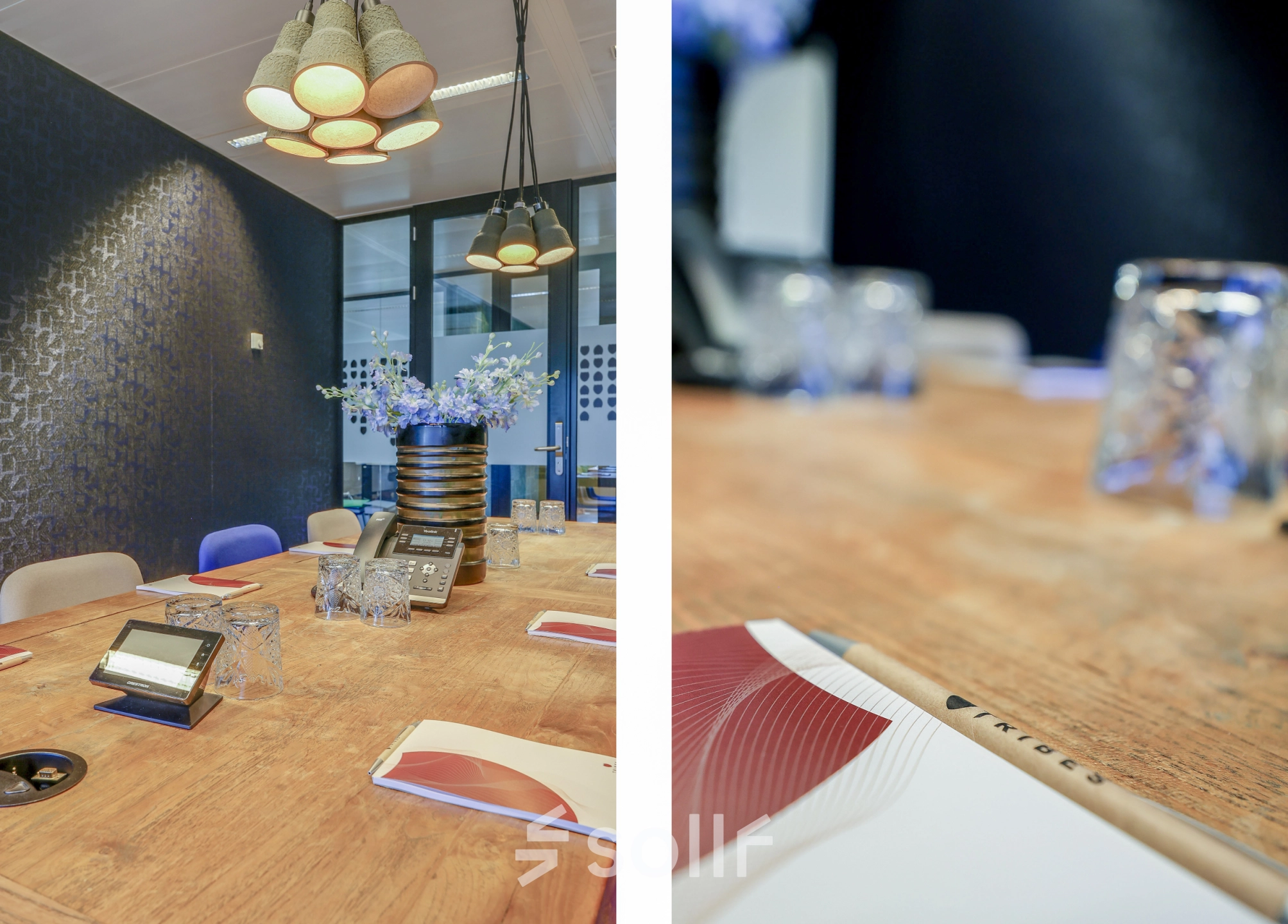 Modern conference room at Prins Bernhardplein 200, Amsterdam Amstel, featuring a wooden table, blue accent chairs, and pendant lighting, ideal for office space rental.
