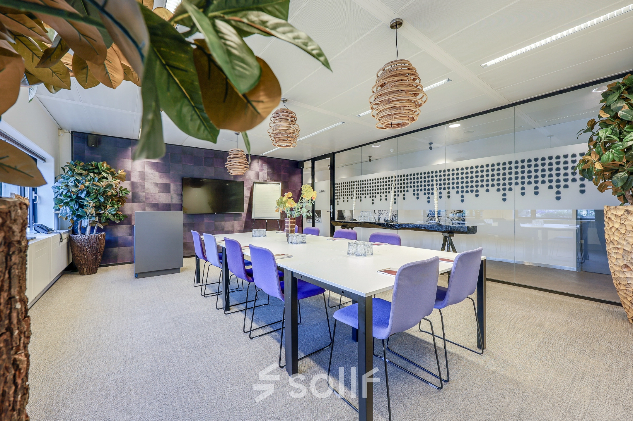 Modern furnished office space at Prins Bernhardplein 200, Amsterdam Amstel, featuring a conference room with a long table and seating for meetings. Ideal for office space rental.