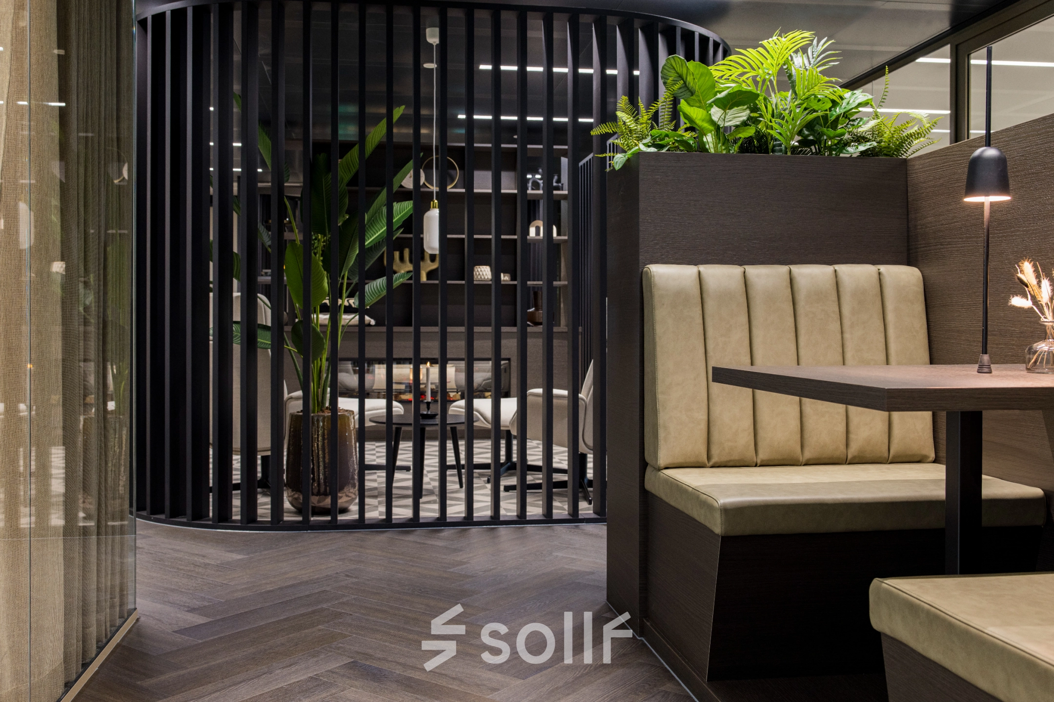 Furnished office space at Walborg 2A, Amsterdam Buitenveldert, featuring sleek seating and lush greenery, ideal for rent office space seekers.