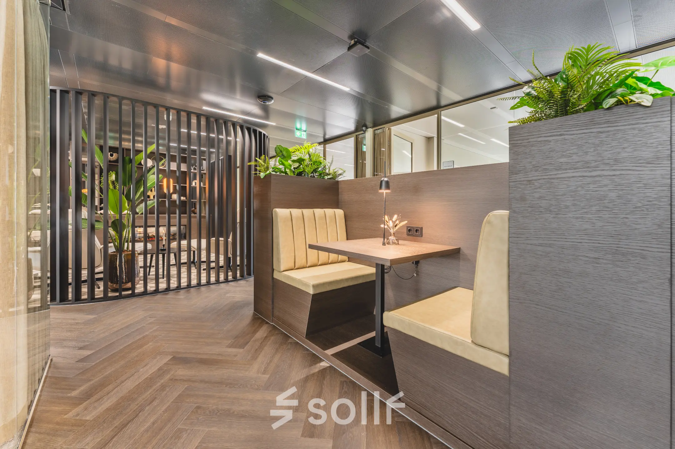 Modern office space with wooden furniture and greenery at Walborg 2A, Amsterdam Buitenveldert. Ideal for businesses seeking office space rental.