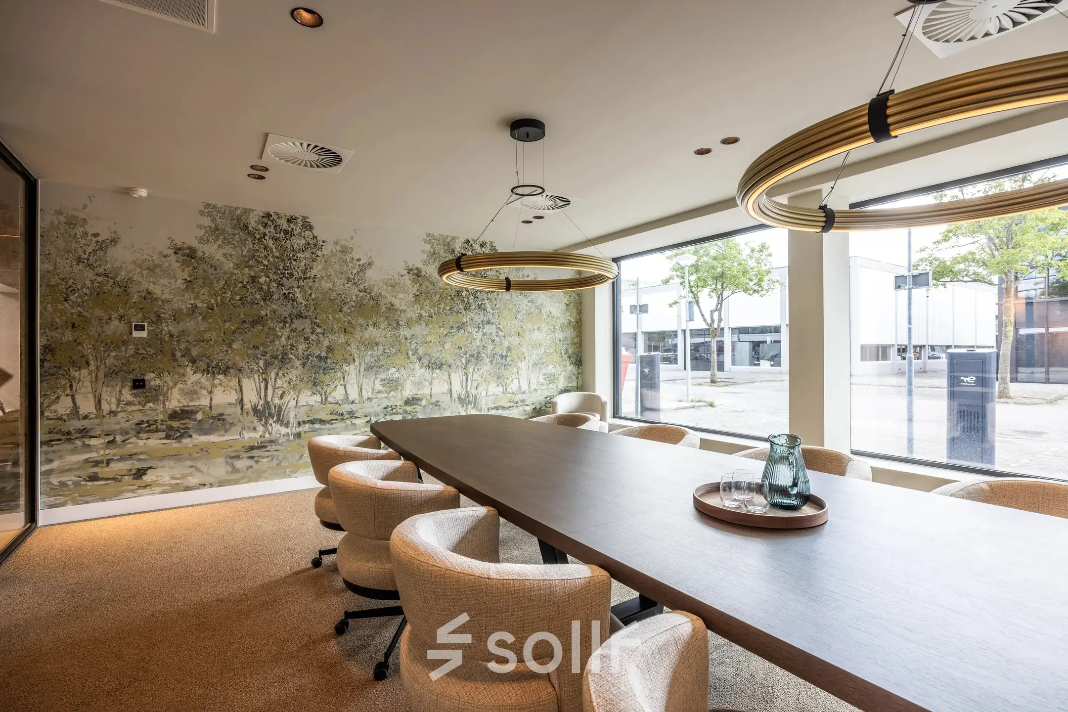 Conference room at Zwaansvliet 1, Amsterdam Buitenveldert, featuring a long table, modern lighting, and large windows. Ideal for office space rental.