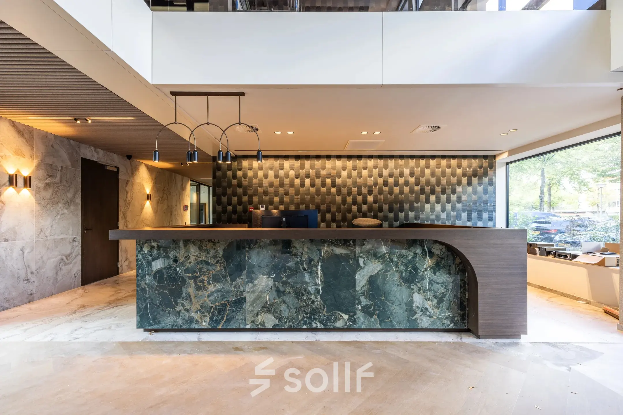 Modern reception area at Zwaansvliet 1, Amsterdam Buitenveldert, ideal for office space rental with stylish decor and ample lighting.