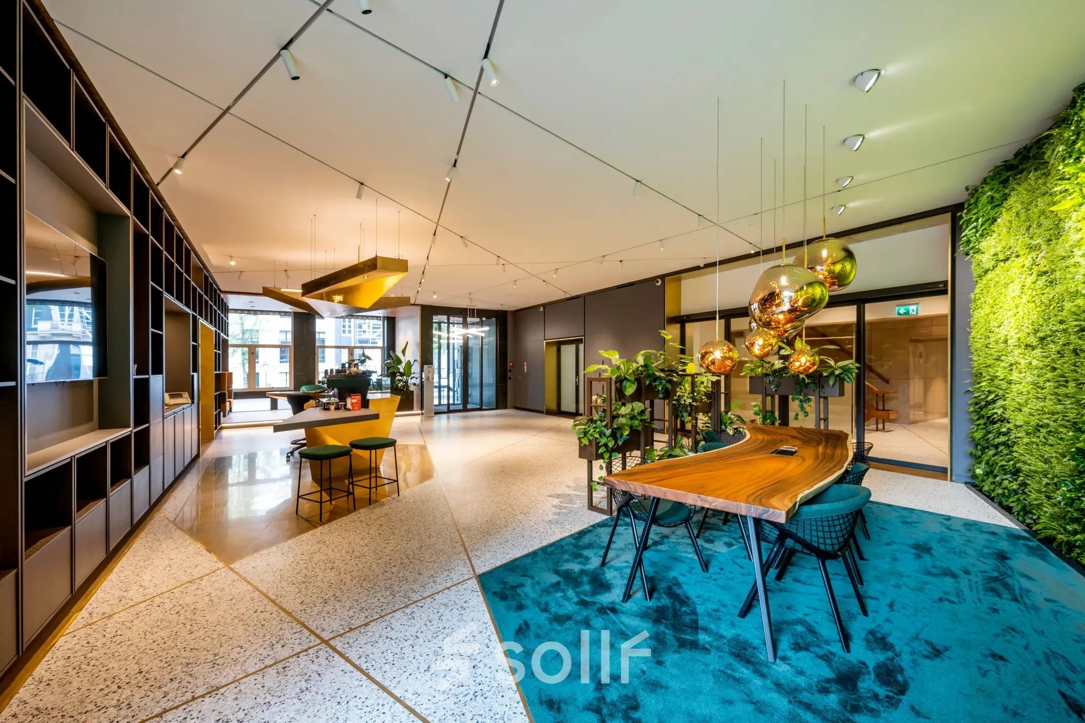 Modern office space at Herengracht 459-469 in the Amsterdam Canal Belt, featuring vibrant decor and ample natural light, perfect for office space rental.