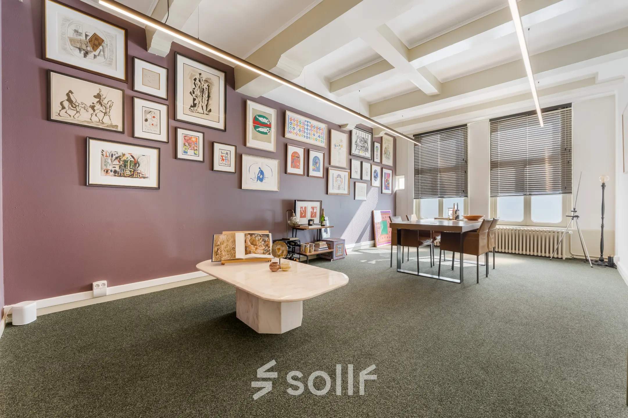 Charming office space in Amsterdam Canal Belt with stylish wall art and modern furnishings, perfect for those seeking office space rental in a prime location.