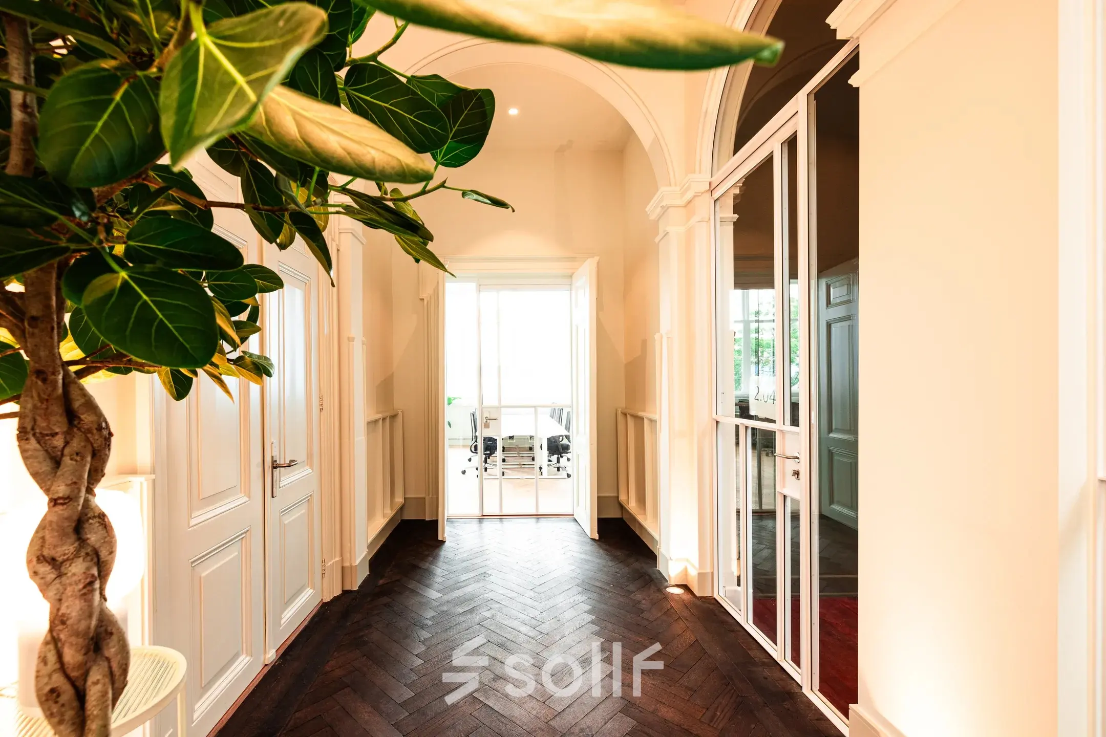 Bright office entrance at Keizersgracht 264 in Amsterdam Canal Belt with elegant decor, leading to a workspace. Perfect for those seeking office space rental.