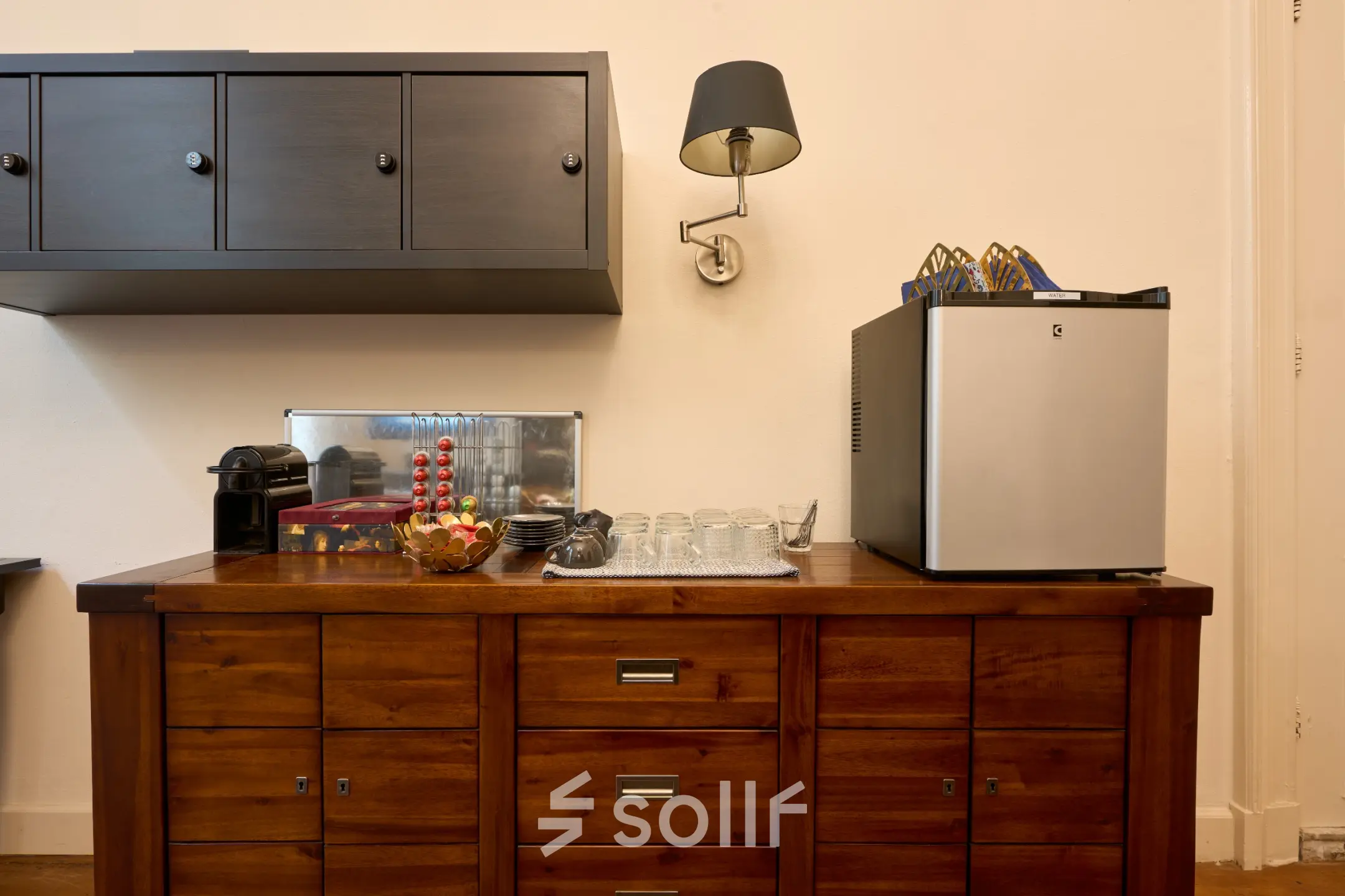 Wooden cabinet with coffee maker, glasses, and a small fridge in an office at Keizersgracht 391A, Amsterdam Canal Belt. Ideal for office space rental needs.
