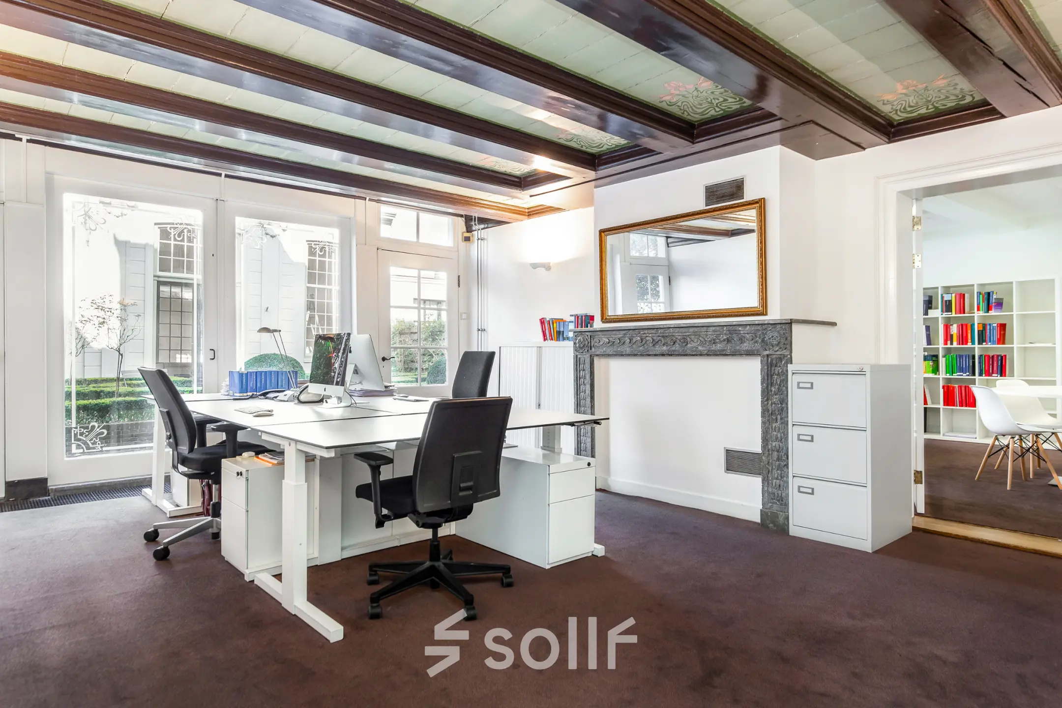 Bright office space with desks, chairs, and a view of the garden, suitable for rent office space at Keizersgracht 62-64, Amsterdam Canal Belt.