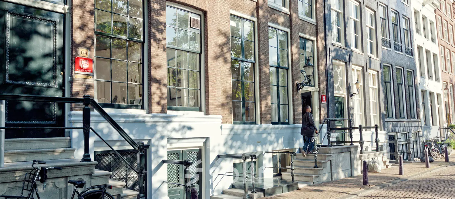 Exterior view of Keizersgracht 62-64 in Amsterdam Canal Belt, showcasing classic architecture ideal for office space rental.