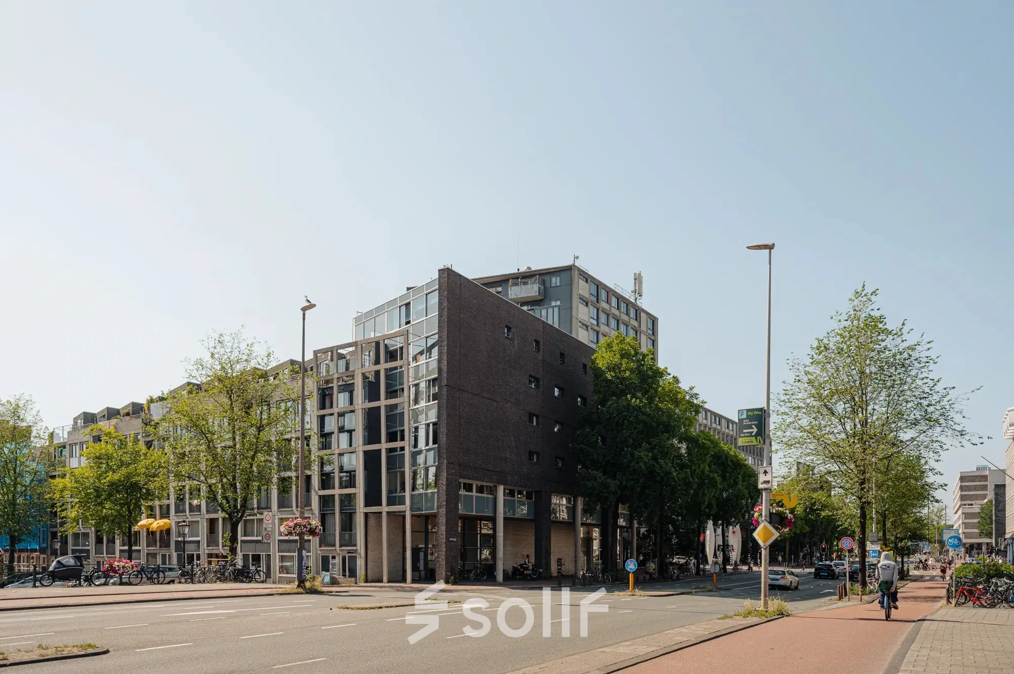 Exterior view of an office to rent at Weesperstraat 394-396, Amsterdam Canal Belt, showcasing the building and street.