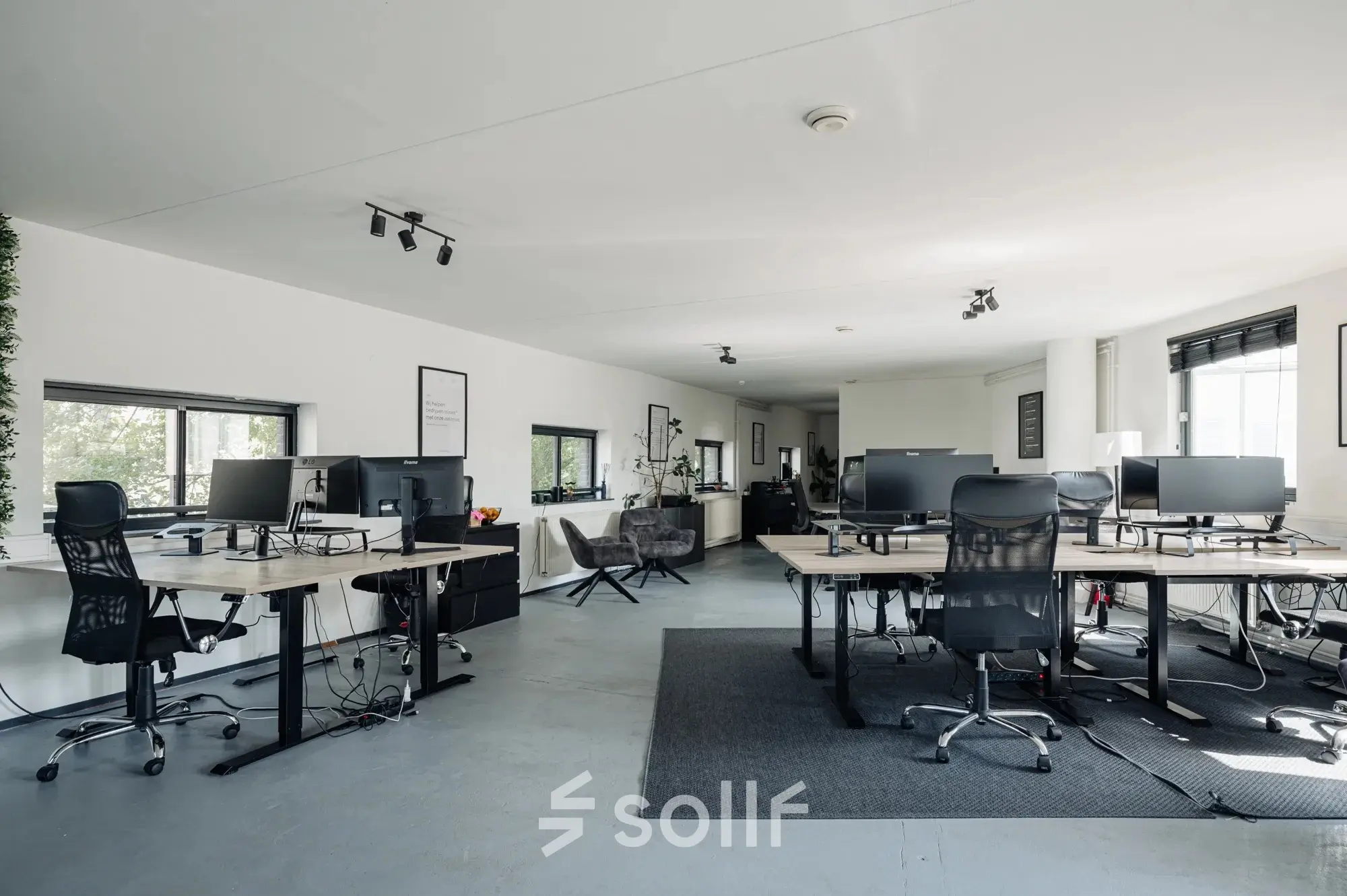 Spacious office to rent in Amsterdam Canal Belt with modern workstations and ergonomic chairs, located at Weesperstraat 394-396. Ideal for businesses seeking office space rental.