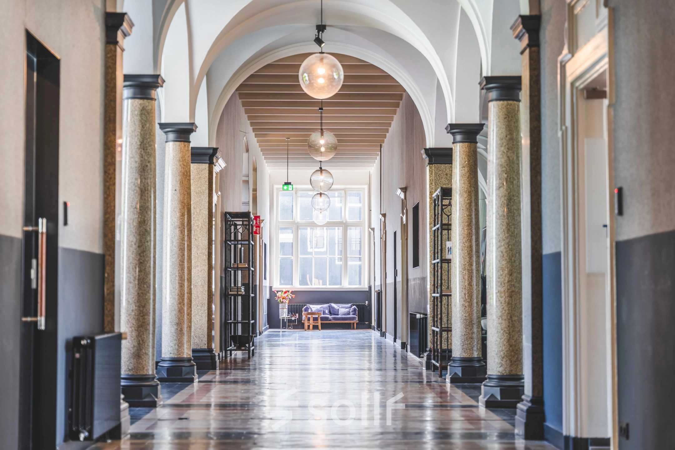 Bright hallway with arches in Amsterdam Center, suitable for office space rental at Raamplein 1.