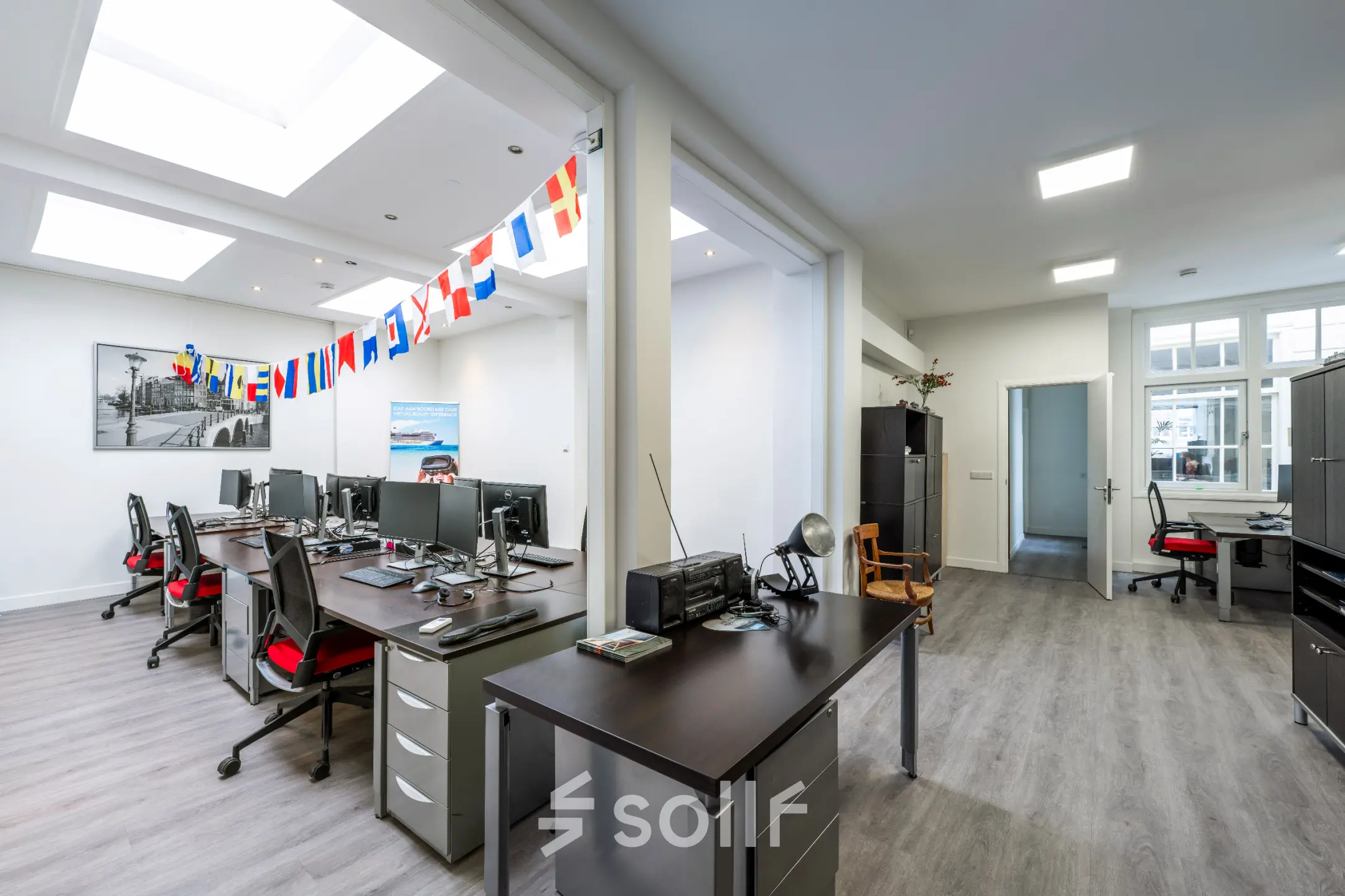 Bright Amsterdam Center office space for rent at Rokin 105 105 with furnished workstations and lively decor.