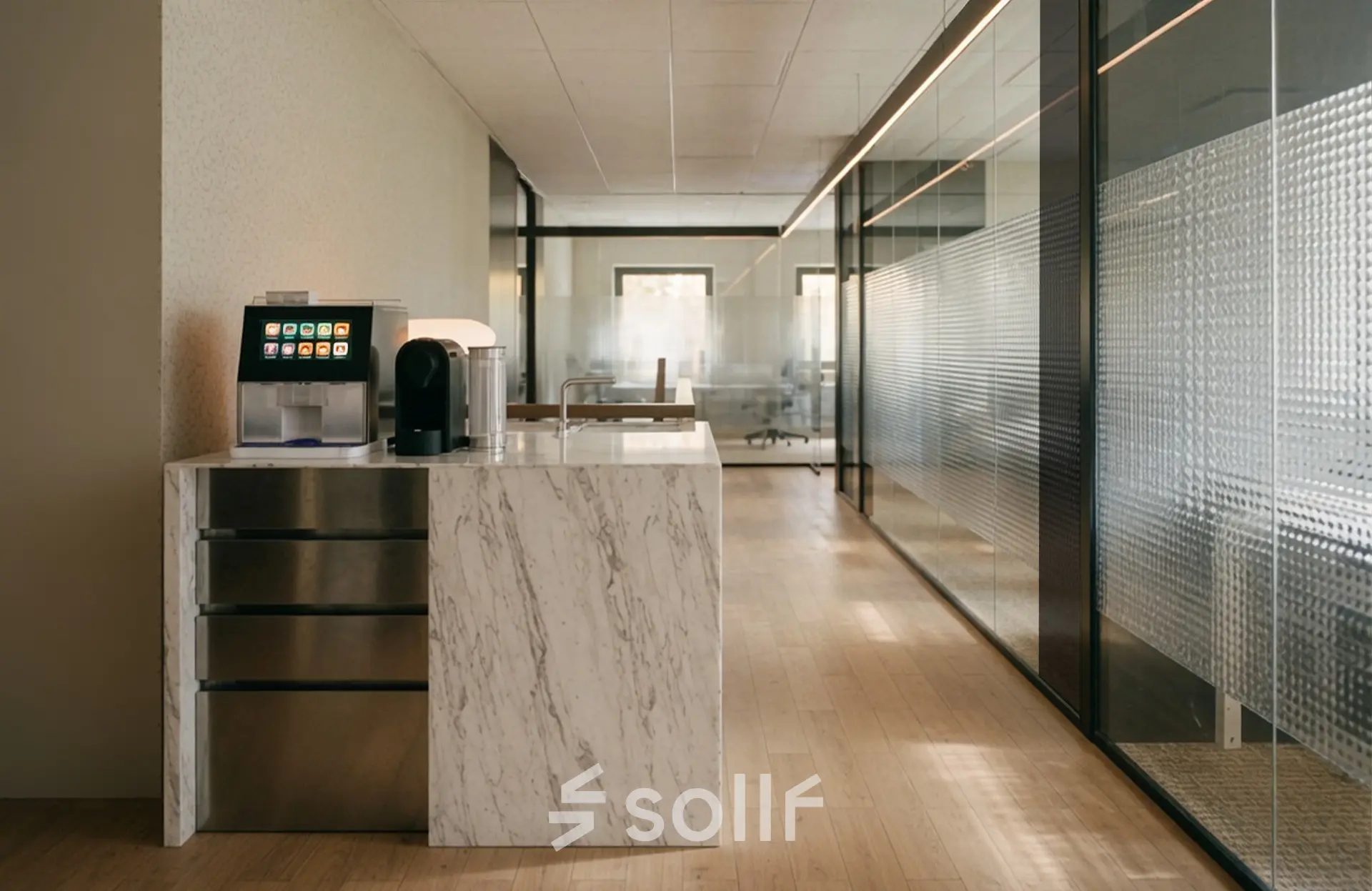 Modern office interior at Weteringschans 126, Amsterdam Center with sleek marble counter and glass partitions, ideal for office space rental.