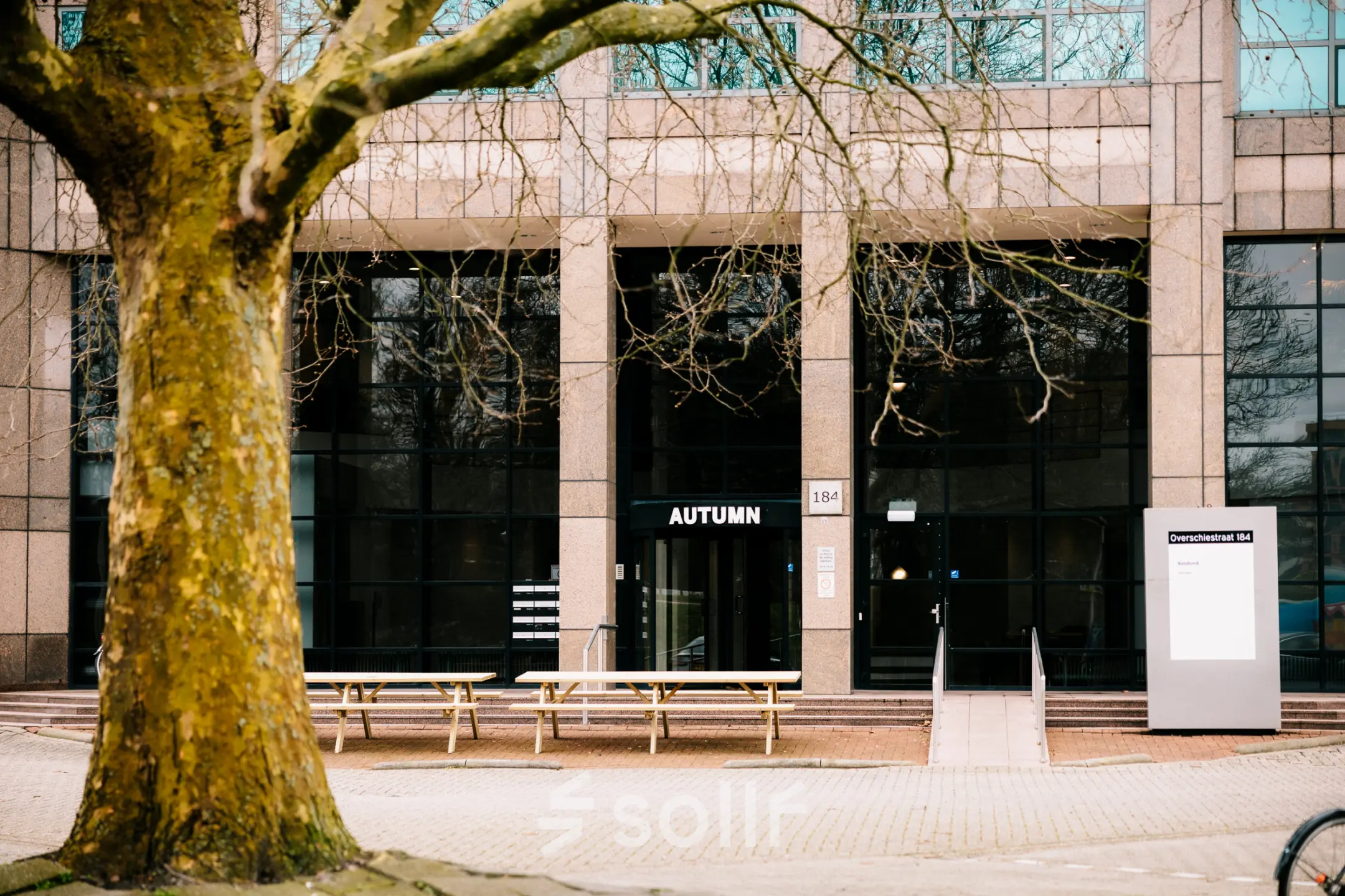 Exterior view of Overschiestraat 182, an office to rent in Amsterdam De Schinkel. The building features large windows and a welcoming entrance.