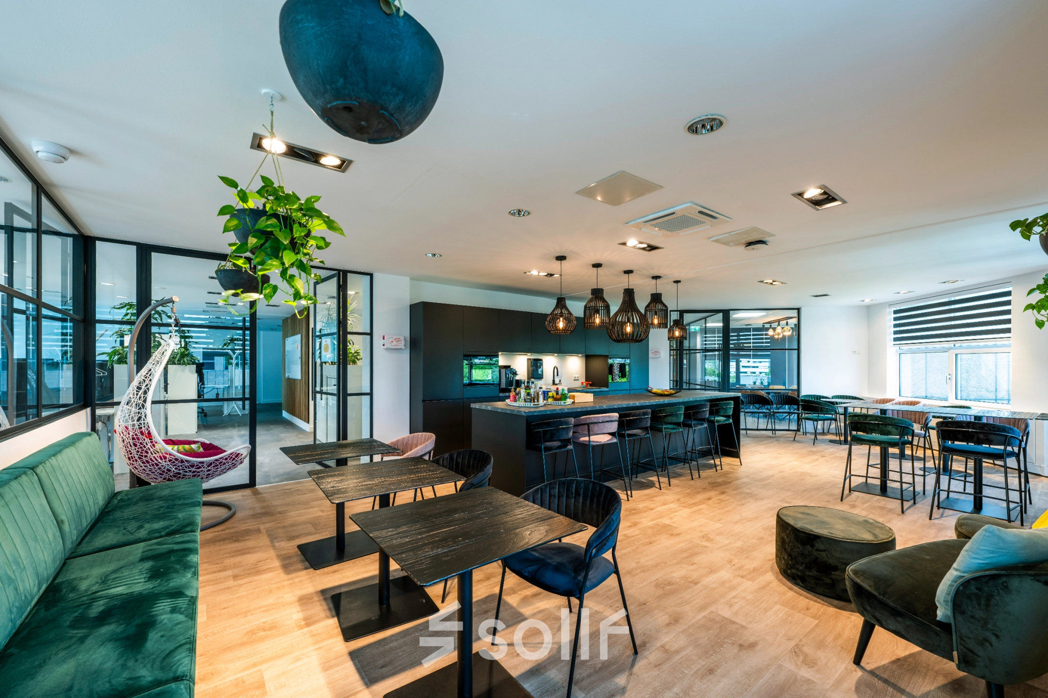 Inviting office space at Overschiestraat 186, Amsterdam De Schinkel, featuring well-furnished workspaces with modern seating and ambient lighting, perfect for office space rental needs.