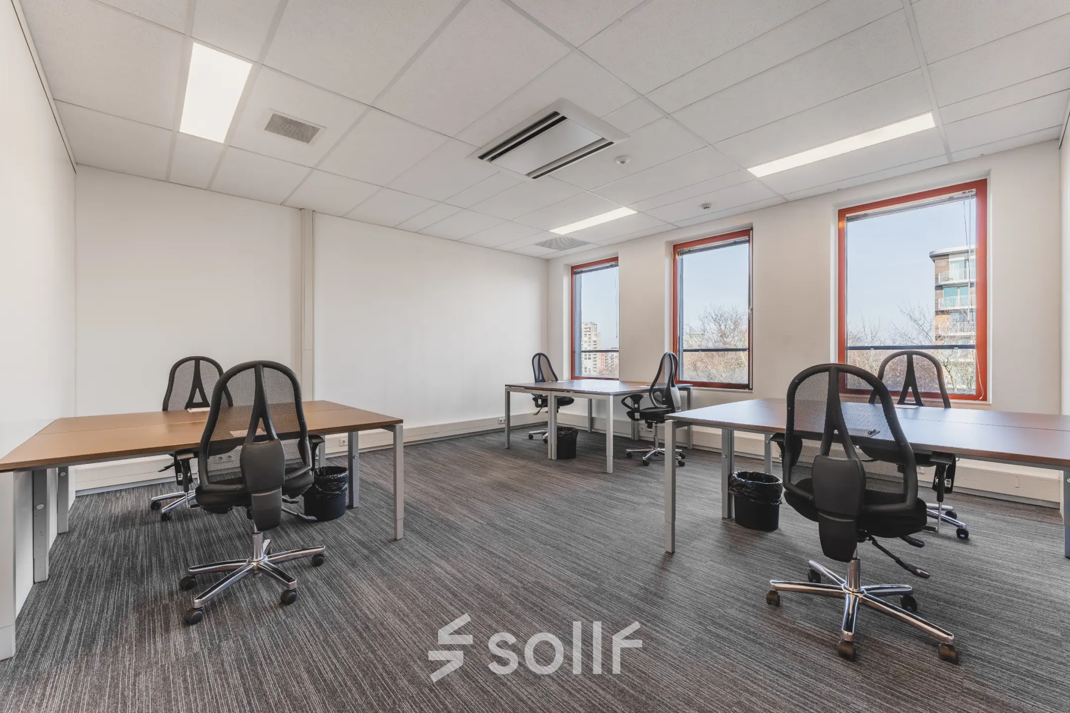 Bright office space rental at Daalwijkdreef 47, Amsterdam Duivendrecht, featuring multiple desks and chairs with natural light streaming in.