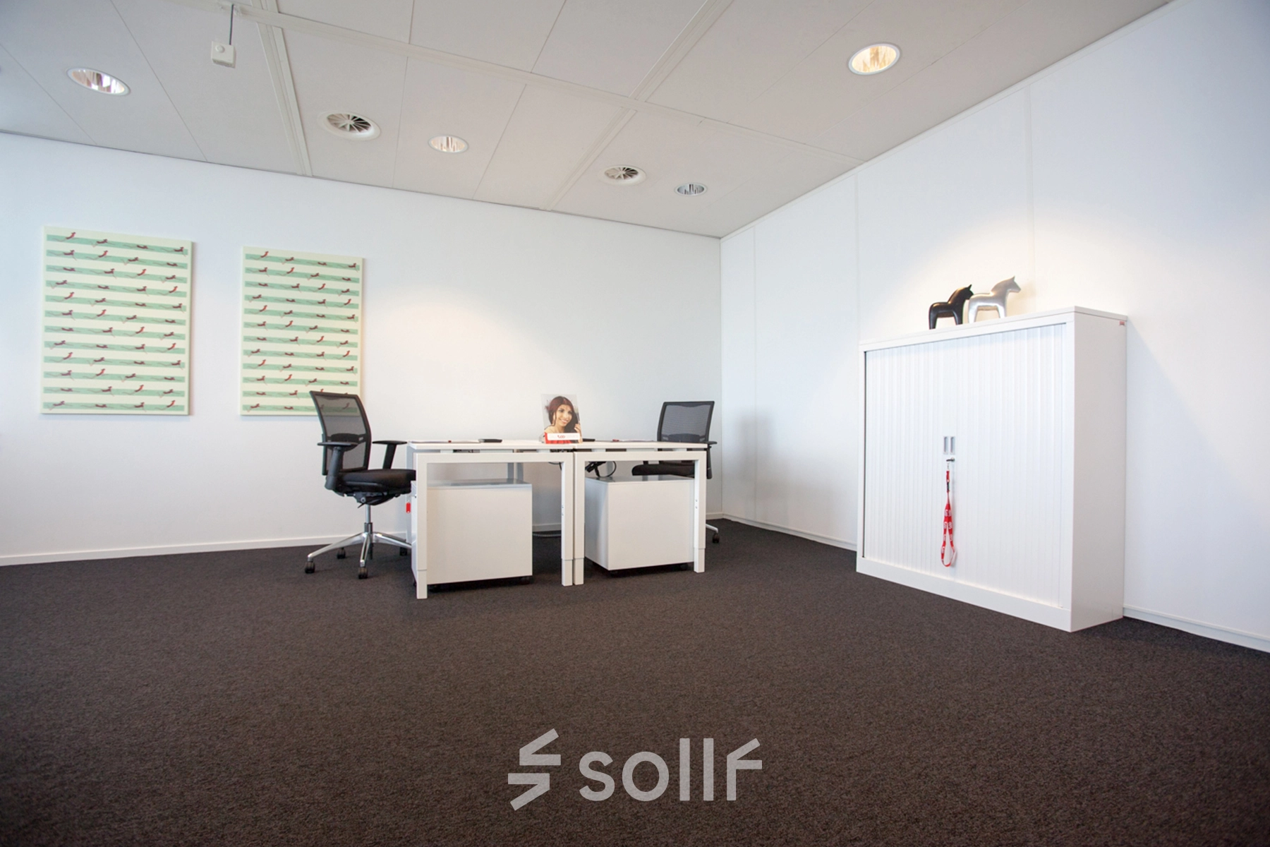 Bright office space at Piet Heinkade 55, Amsterdam East, featuring modern furnishings and minimal decor, available for office space rental.