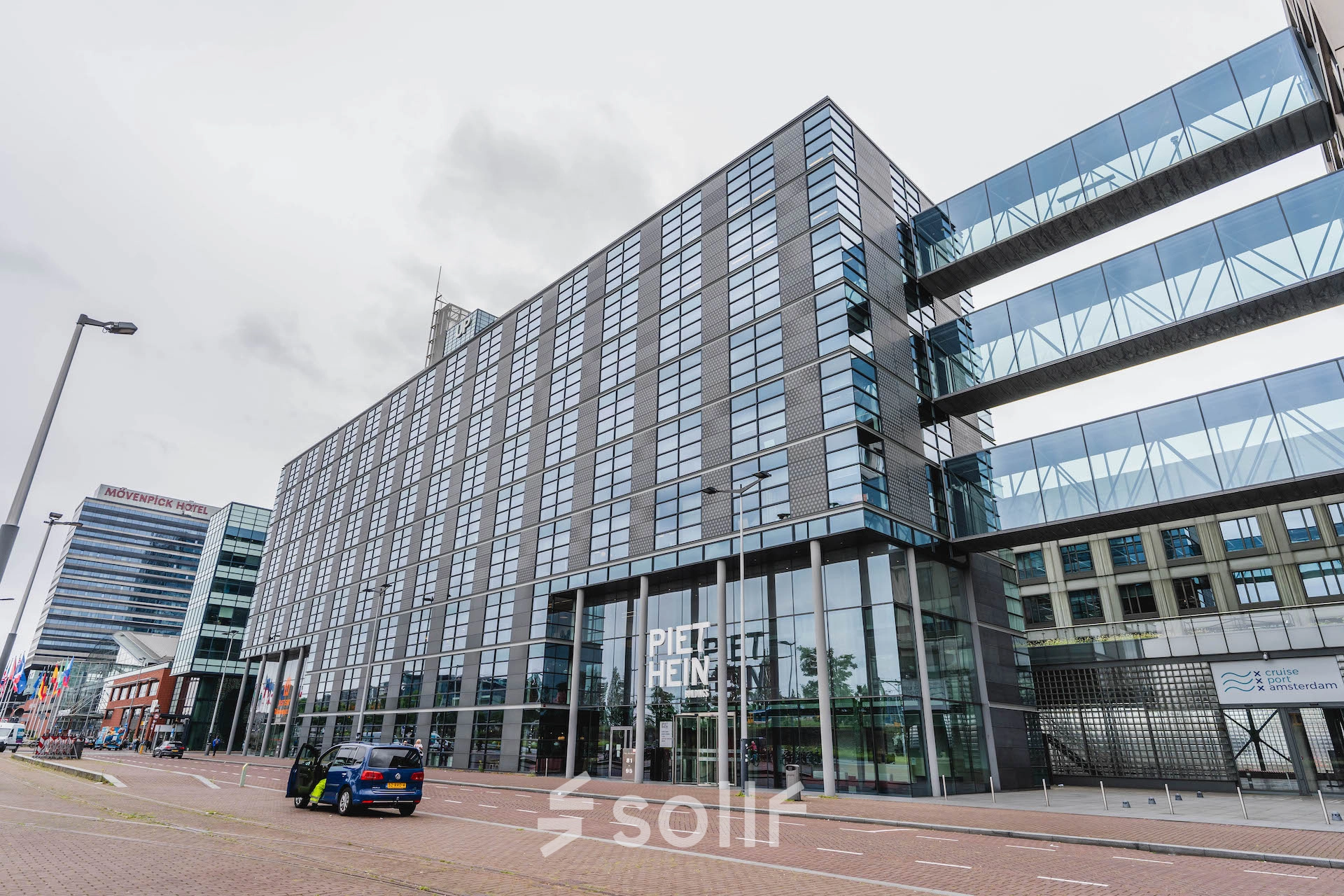 Street view of Piet Heinkade 95B, Amsterdam East, showcasing a modern office building available for rent office space.