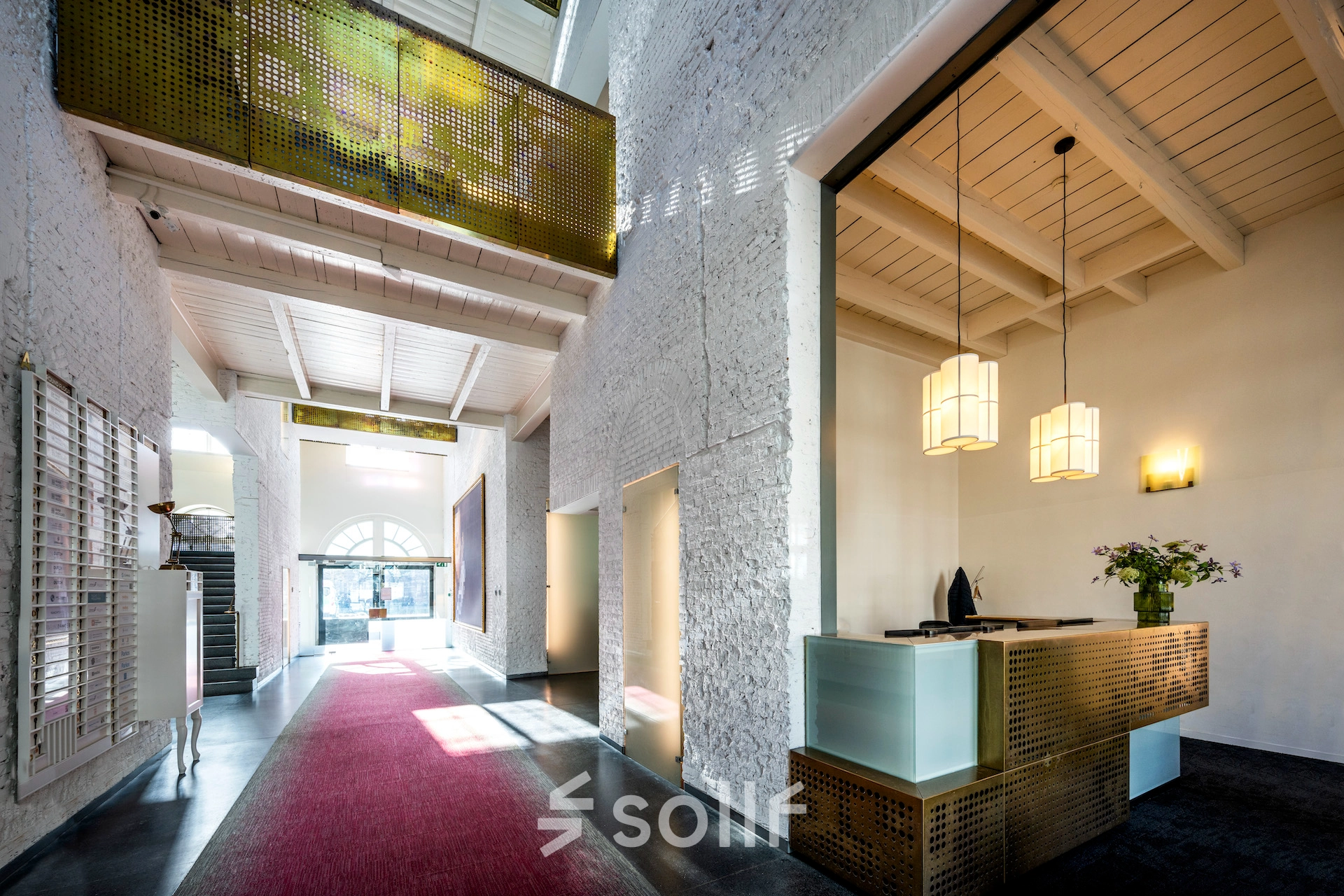 Spacious office entrance at Sarphatistraat 370 in Amsterdam East with modern design and welcoming reception. Ideal for office space rental.