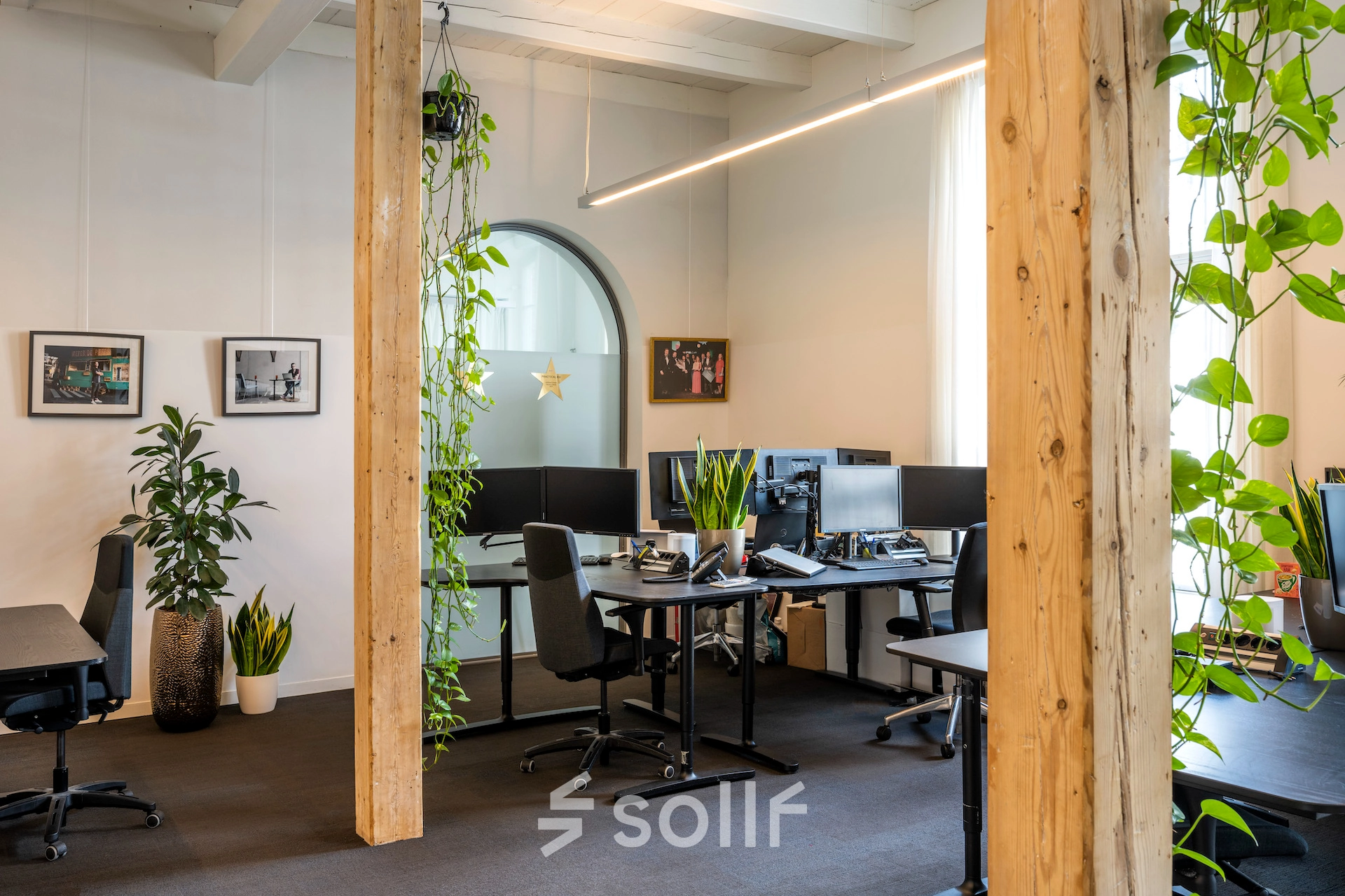 Bright office space at Sarphatistraat 370, Amsterdam East, featuring modern furnishings and plants, available for office space rental.