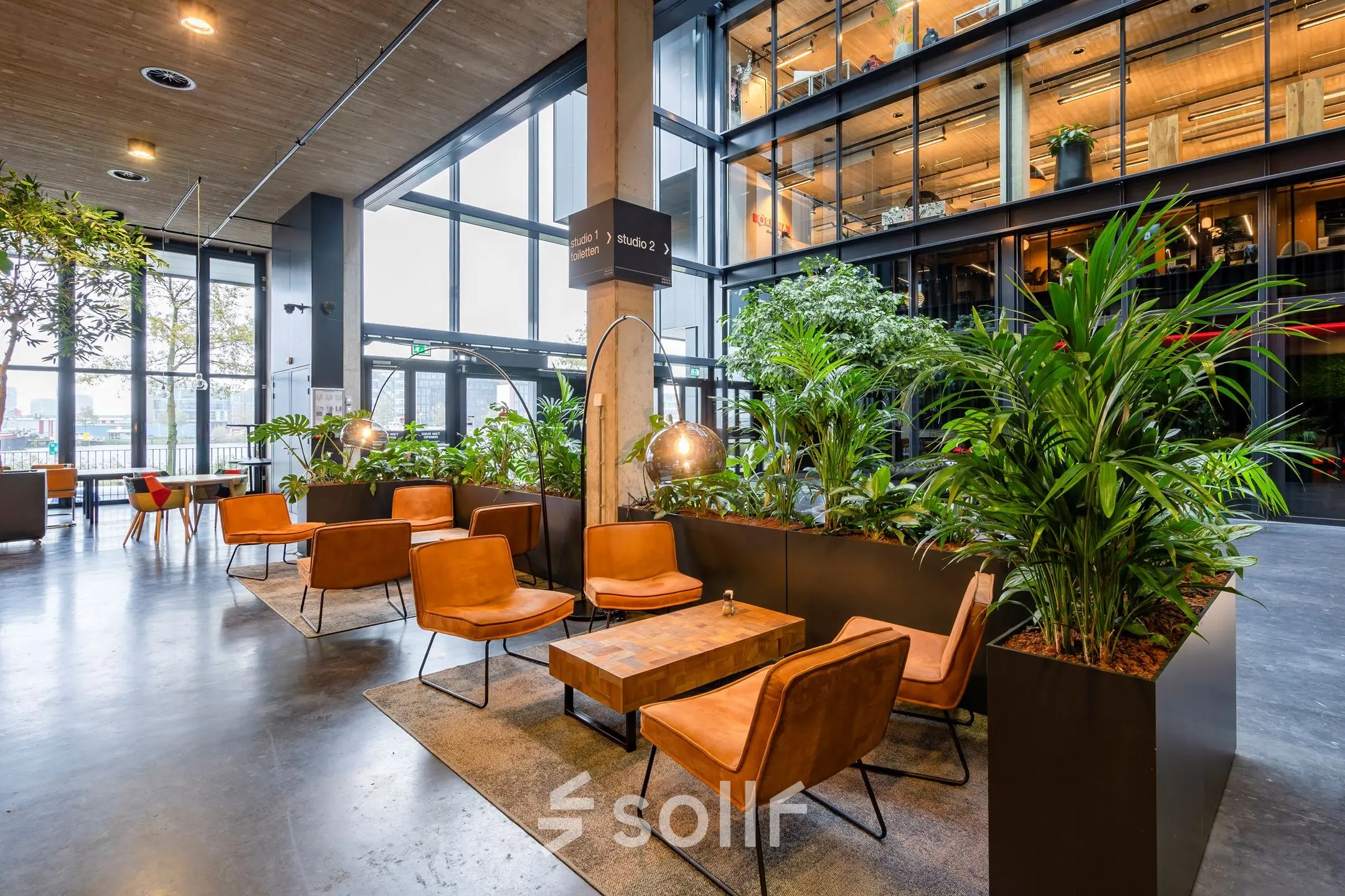 Spacious, stylish office space at Moermanskkade 109-113 in Amsterdam Houthavens, featuring modern furnishings and large windows offering ample natural light.