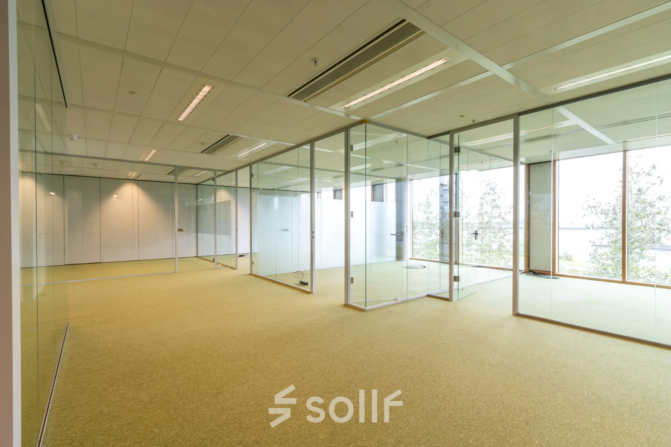 Spacious, unfurnished office space with glass partitions at Pedro de Medinalaan 1-9 1-9 in Amsterdam IJburg, suitable for office space rental.