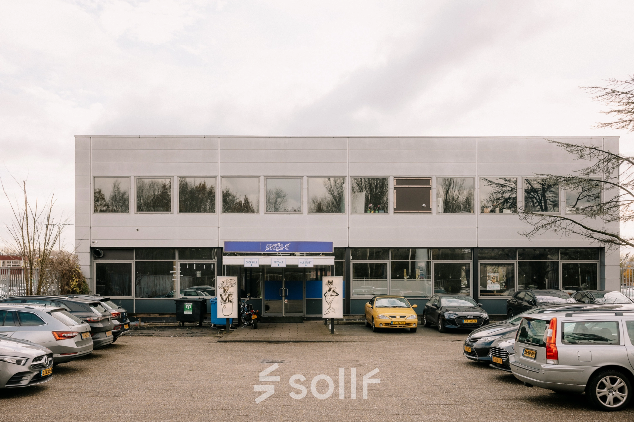 Exterior view of office building at Anthony Fokkerweg 3, Amsterdam New-West, surrounded by a parking area. Ideal for office space rental.