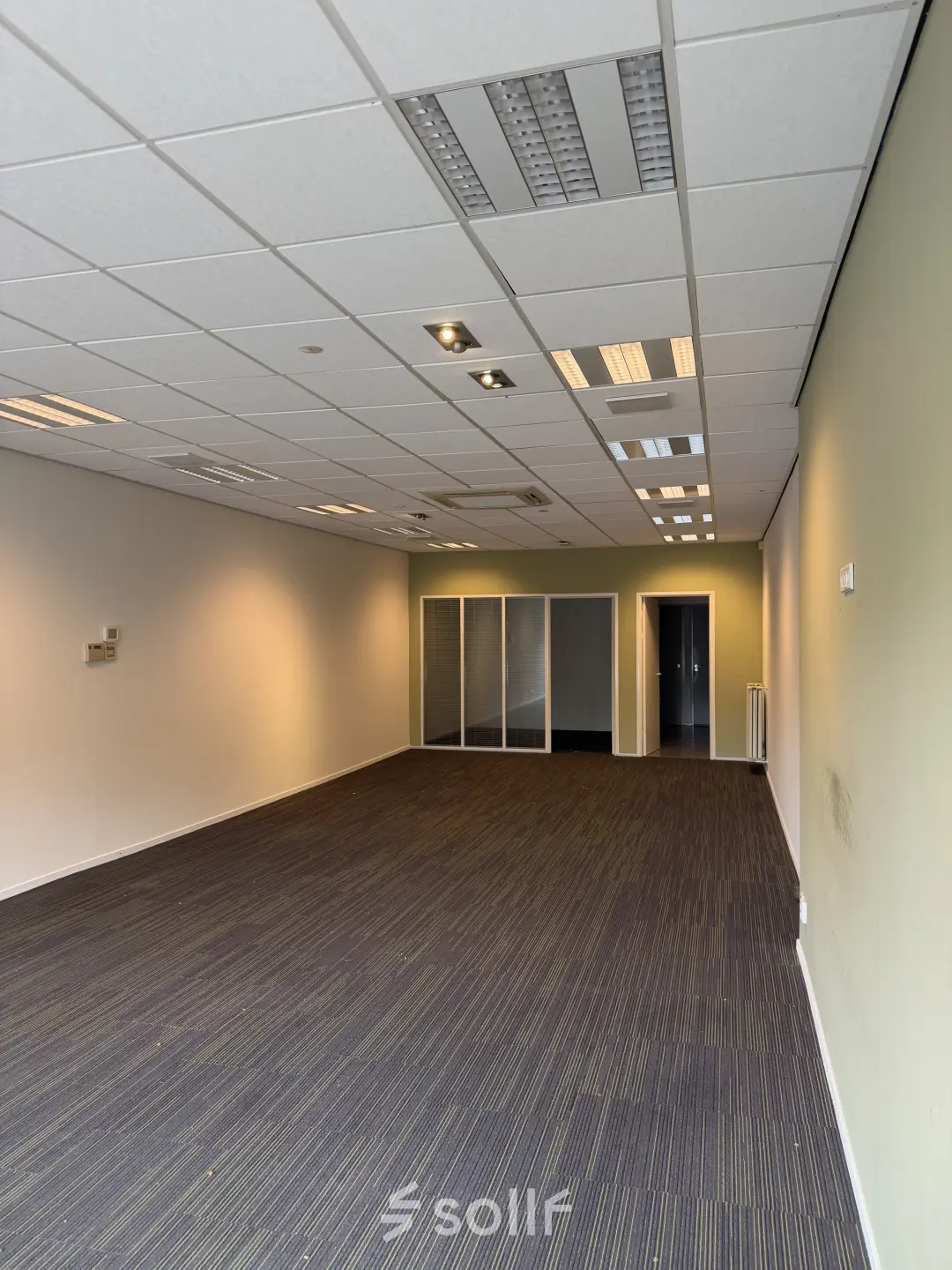 Unfurnished office space available for rent at Buikslotermeerplein 430, Amsterdam North. Spacious interior with large windows, suitable for customizable office space rental needs.