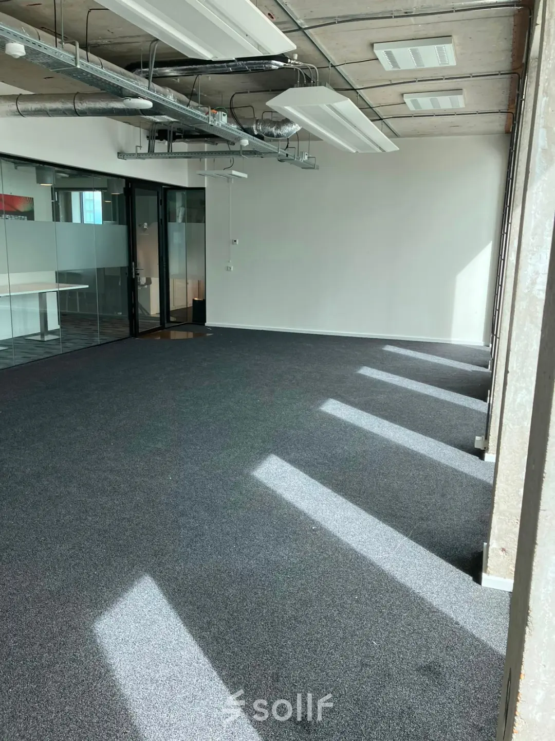 Bright, unfurnished office space with large windows in Overhoeksplein 1, Amsterdam North, ideal for rent office space and customizable to your needs.